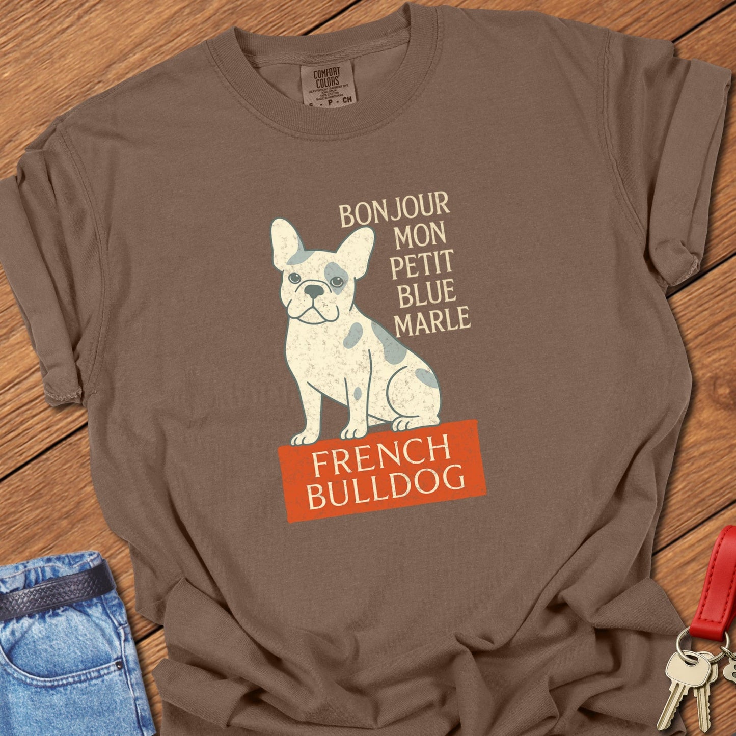 French bulldog vintage French typography illustration with blue merle Frenchie graphic printed on espresso Comfort Colors t shirt
