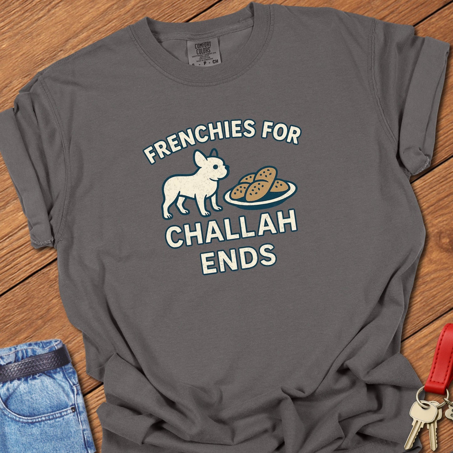 French bulldog humorous food illustration with challah bread graphic and playful slogan printed on pepper Comfort Colors t shirt