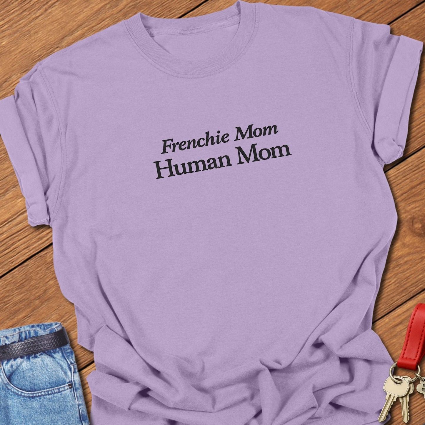 Comfort Colors garment-dyed Frenchie mom t shirt with ivory serif “Frenchie Mom Human Mom” typography on a orchid tee, designed for women balancing motherhood and French bulldog life.