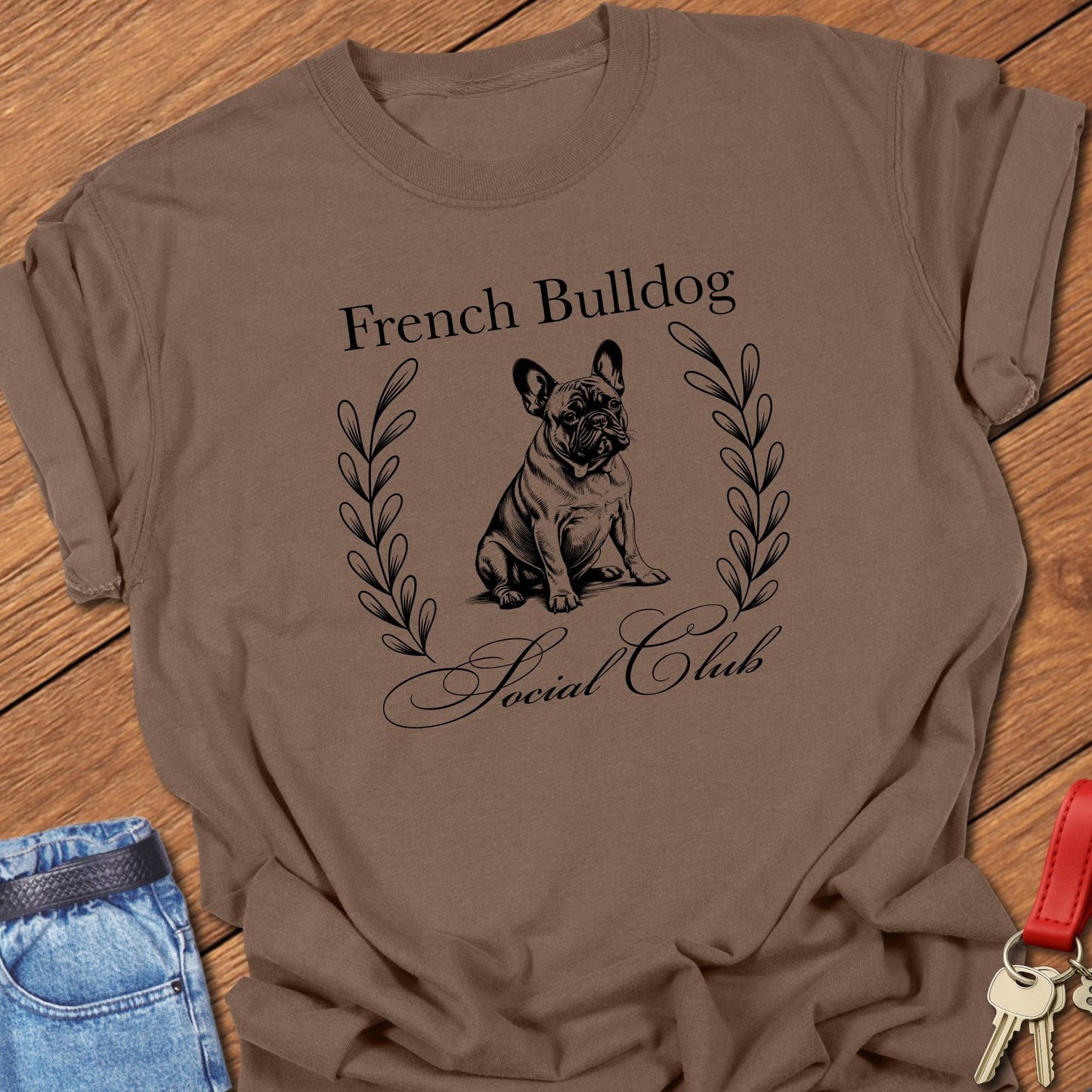 French bulldog vintage line art design with laurel wreath printed on espresso Comfort Colors t shirt.