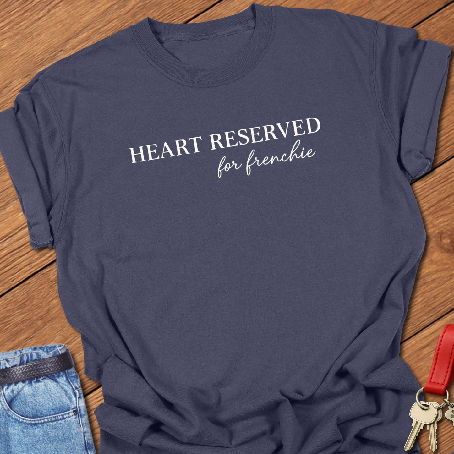 French bulldog heart reserved for frenchie text graphic printed on navy Comfort Colors t shirt.