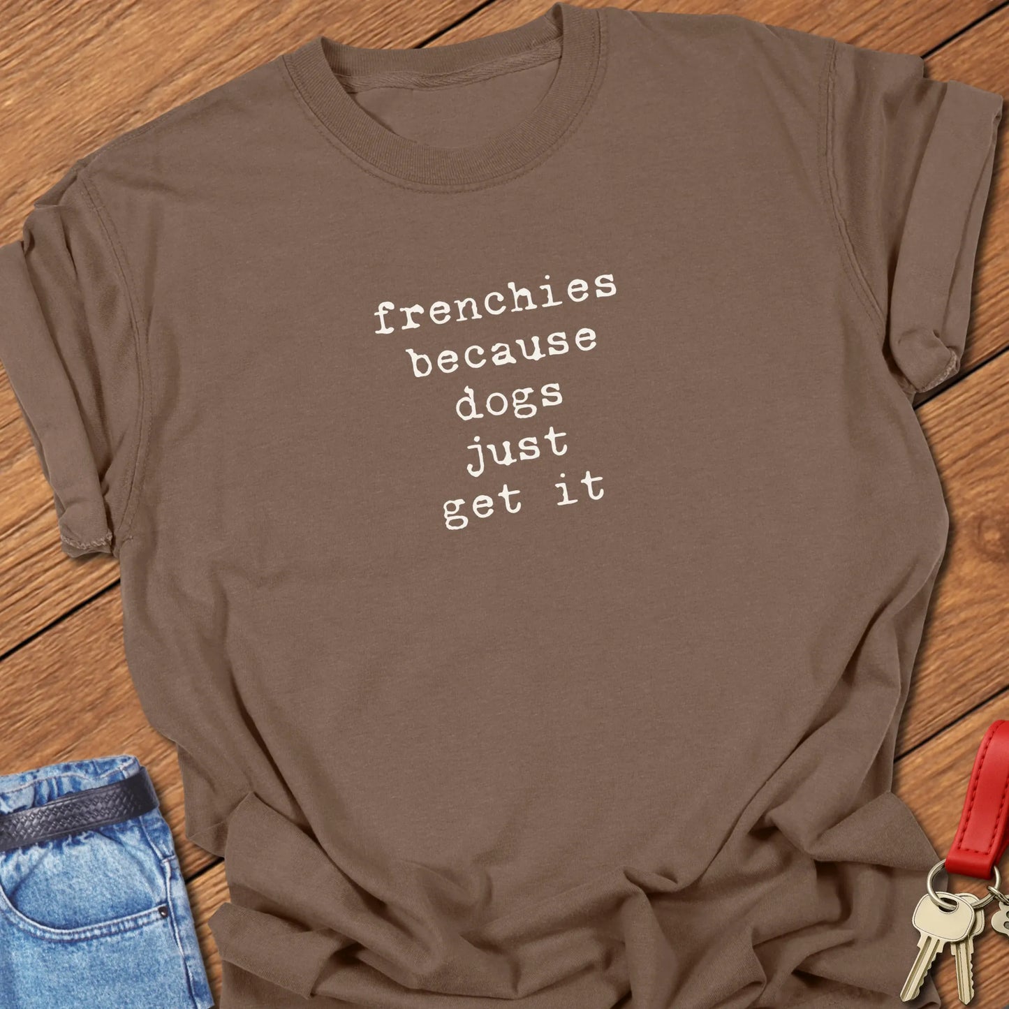 A Comfort Colors® cotton t-shirt in Espresso featuring the phrase "Frenchies Because Dogs Get It" in elegant serif typography.