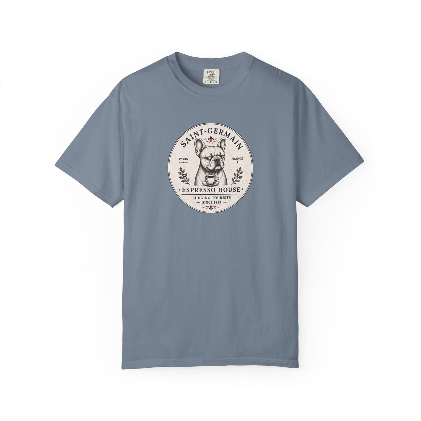 Saint-Germain Espresso House French Bulldog graphic t-shirt featuring the slogan "Judging Tourists Since 1889" and vintage Paris café artwork in Blue Jean color.