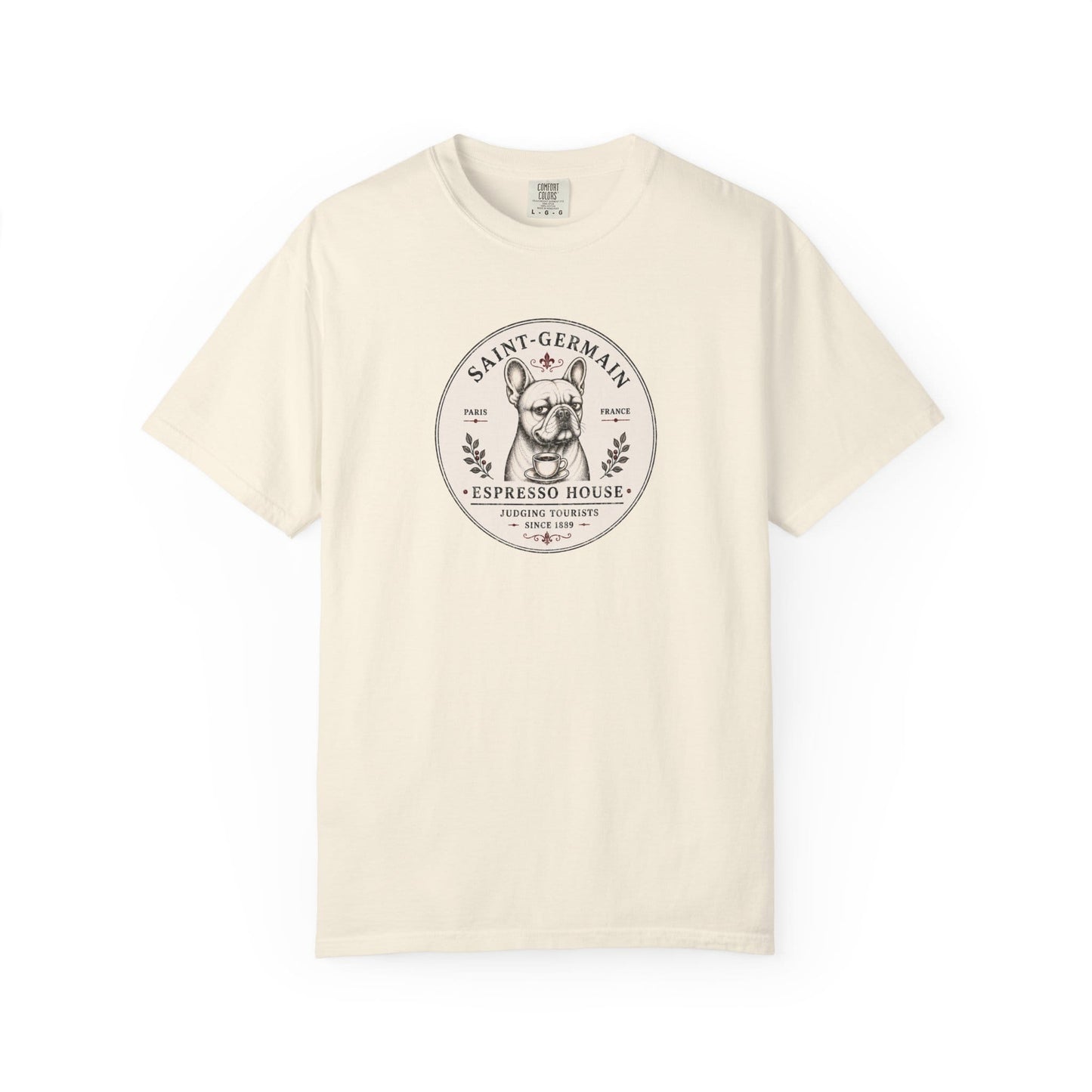 Saint-Germain Espresso House French Bulldog graphic t-shirt featuring the slogan "Judging Tourists Since 1889" and vintage Paris café artwork in Ivory color.