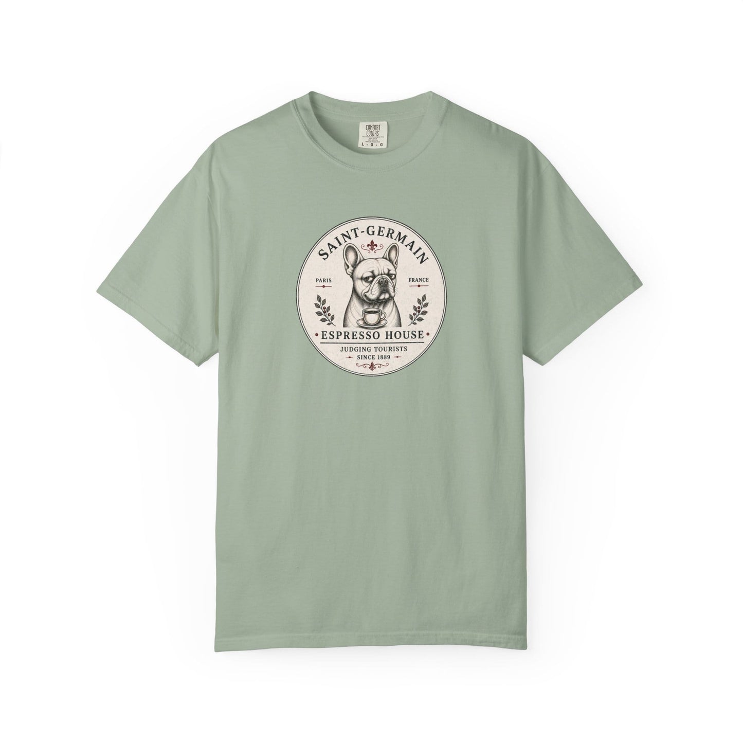 Saint-Germain Espresso House French Bulldog graphic t-shirt featuring the slogan "Judging Tourists Since 1889" and vintage Paris café artwork in Bay color.