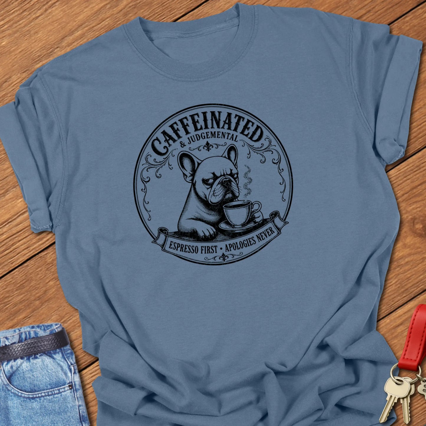 Apologies Never French Bulldog graphic t-shirt featuring "Caffeinated & Judgemental" and "Espresso First. Apologies Never." slogans with vintage café artwork in Blue Jean color.