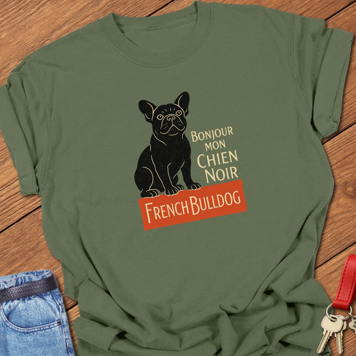 French bulldog vintage French typography illustration with black Frenchie graphic and Bonjour mon chien noir text printed on moss Comfort Colors t shirt