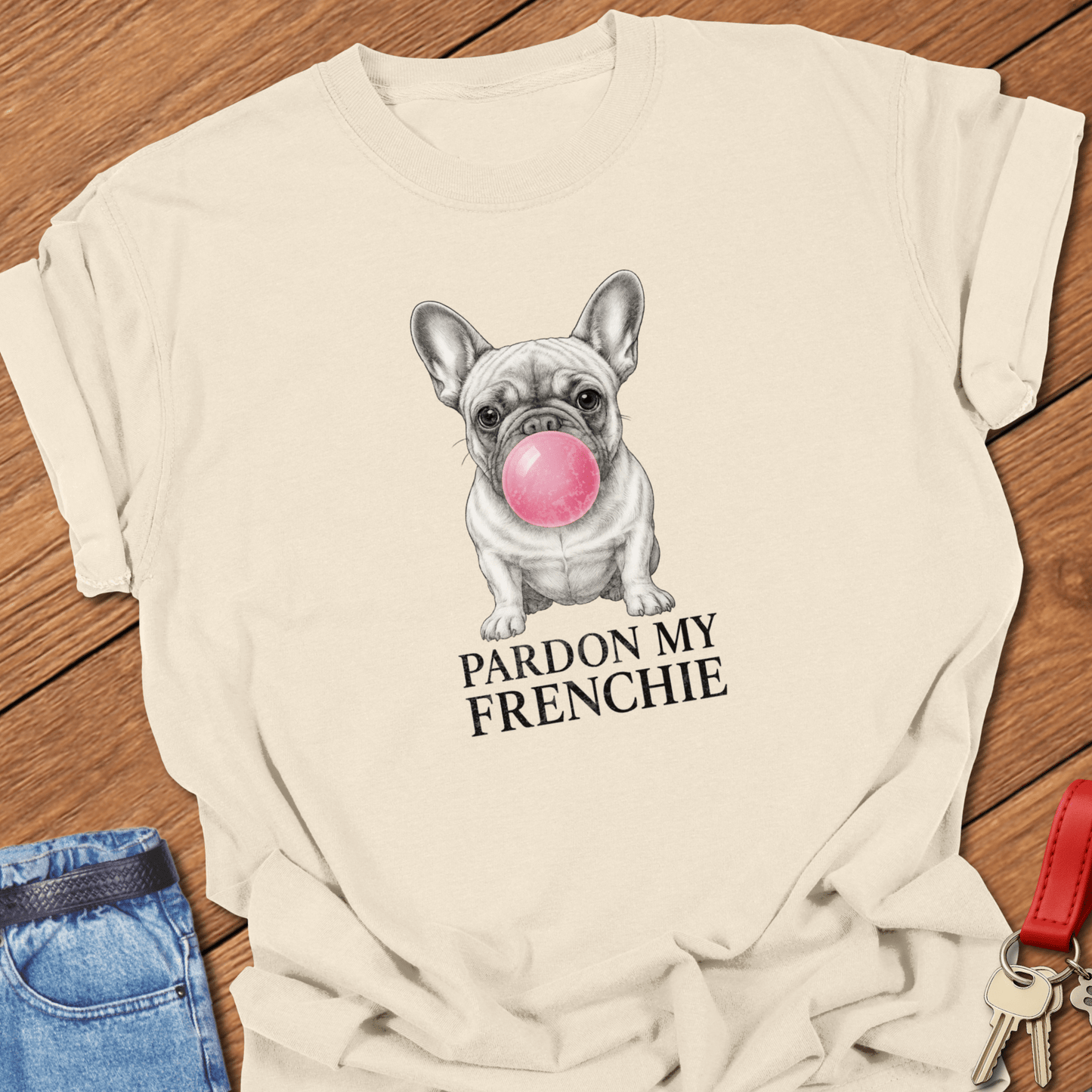 French bulldog bubble gum illustration with “Pardon My Frenchie” text printed on ivory Comfort Colors t shirt