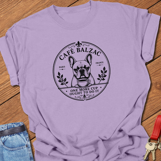 Café Balzac French Bulldog graphic t-shirt featuring "One More Cup Ought To Do It" slogan with vintage Paris café artwork inspired by literary coffee culture in Orchid color.