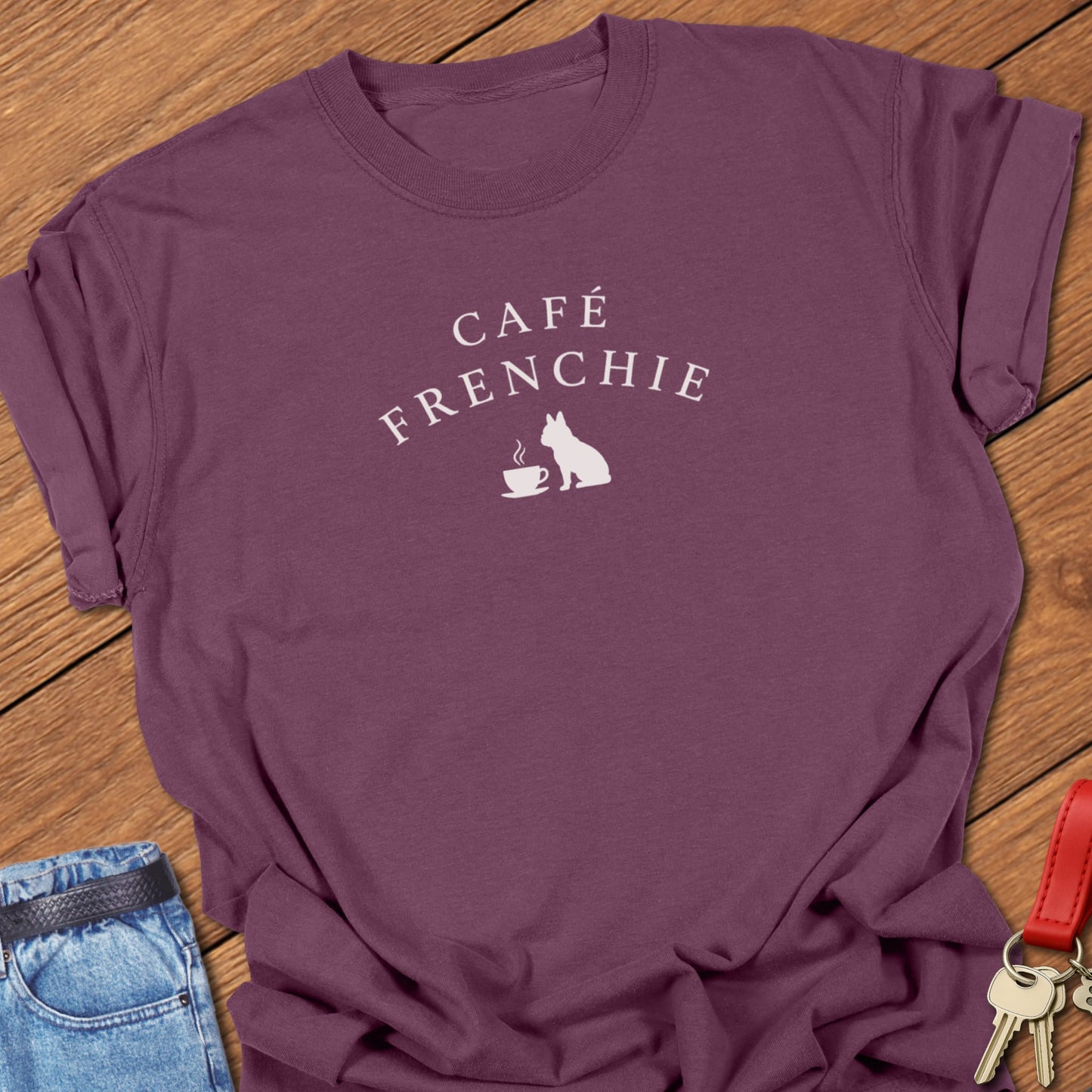 Café Frenchie French Bulldog graphic t-shirt in Comfort Colors Berry featuring a coffee cup and Frenchie silhouette design in soft ivory ink.