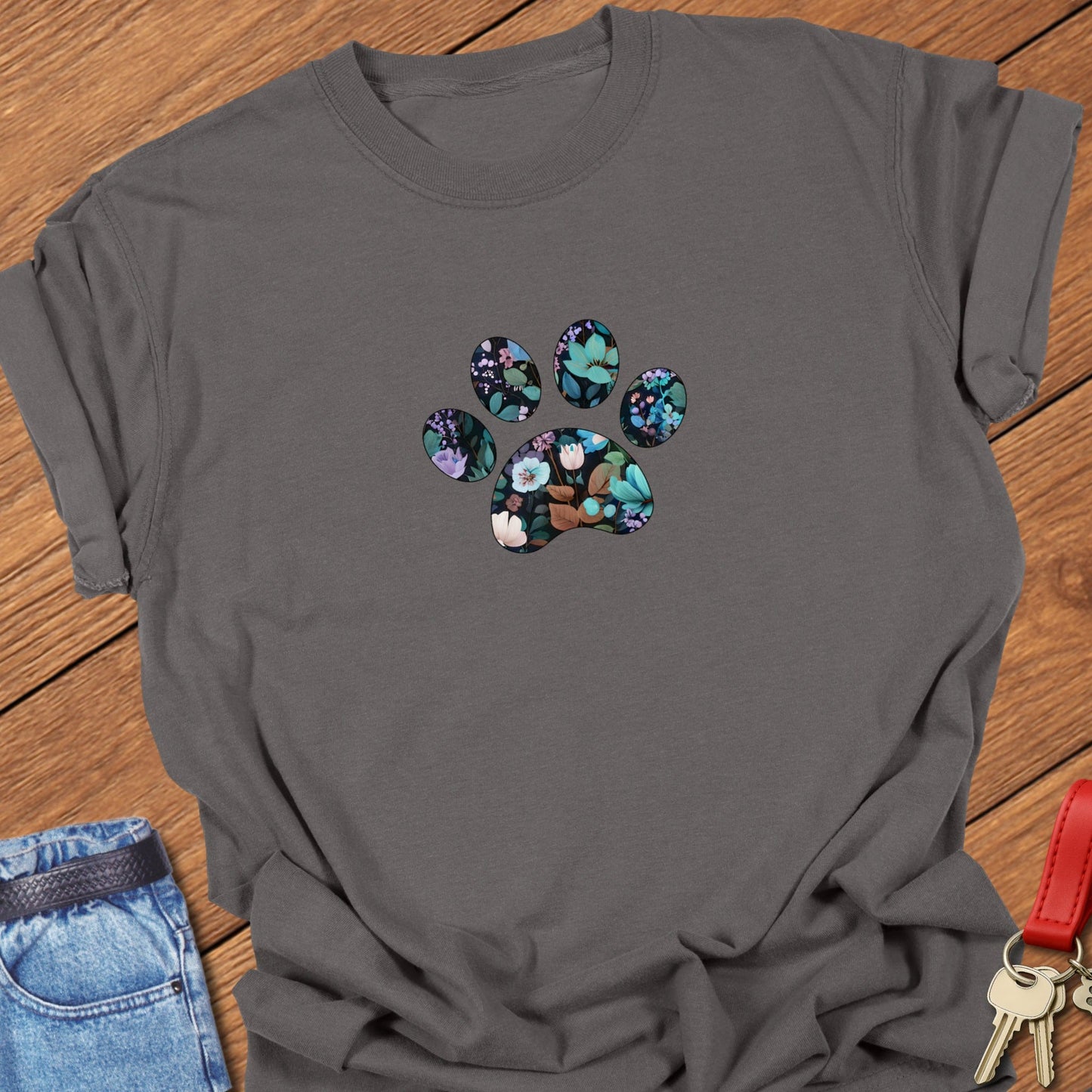 Floral paw print design featuring botanical flowers and leaves arranged inside a paw silhouette for a French Bulldog dog lover t-shirt printed on Comfort Colors garment dyed cotton in Pepper.
