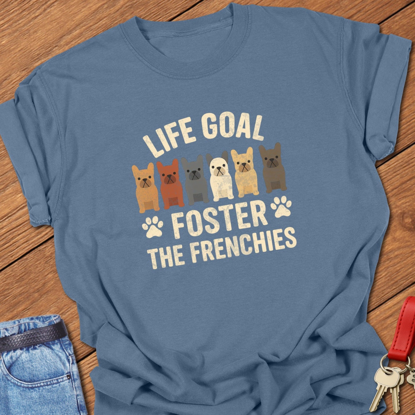 French bulldog foster illustration with multiple Frenchie graphics and bold life goal typography printed on blue jean Comfort Colors t shirt