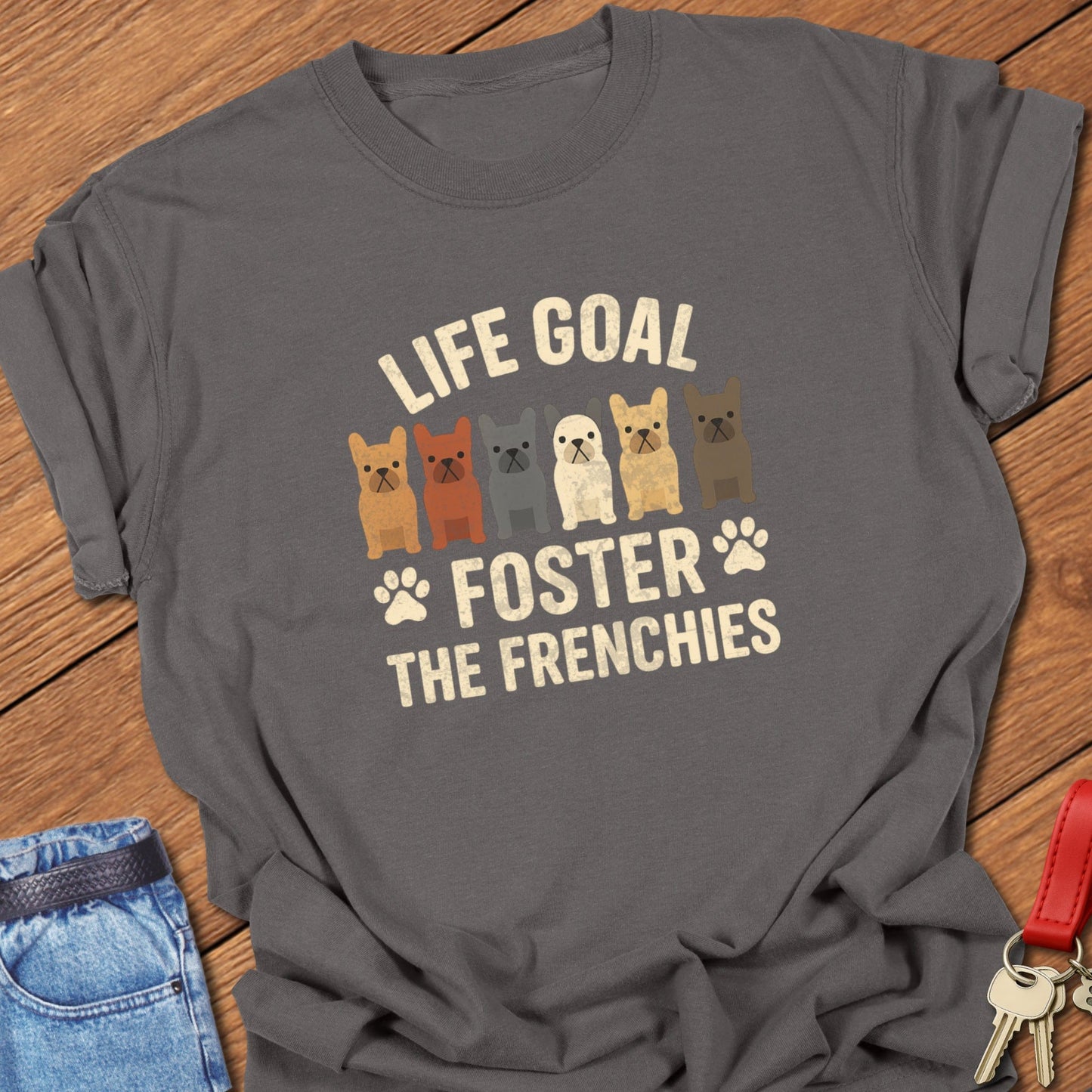 French bulldog foster illustration with multiple Frenchie graphics and bold life goal typography printed on pepper Comfort Colors t shirt