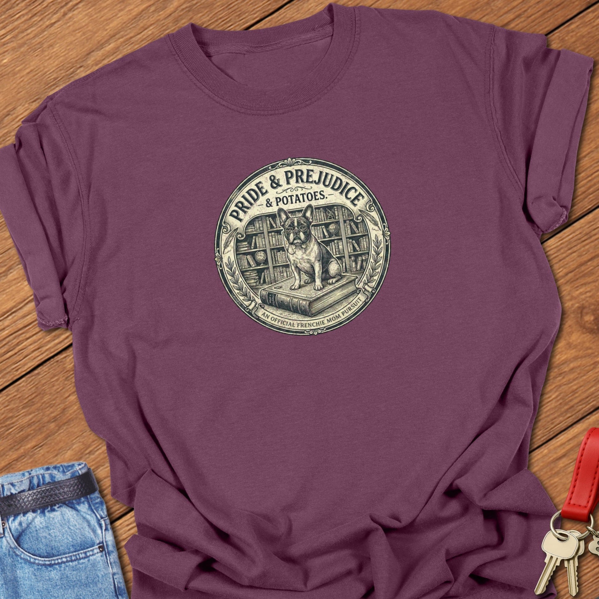 French bulldog vintage book-style “Pride & Prejudice & Potatoes” illustration printed on berry Comfort Colors t shirt