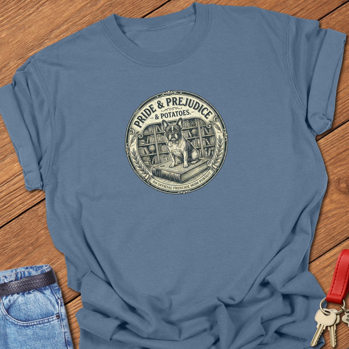 French bulldog vintage book-style “Pride & Prejudice & Potatoes” illustration printed on blue jean Comfort Colors t shirt