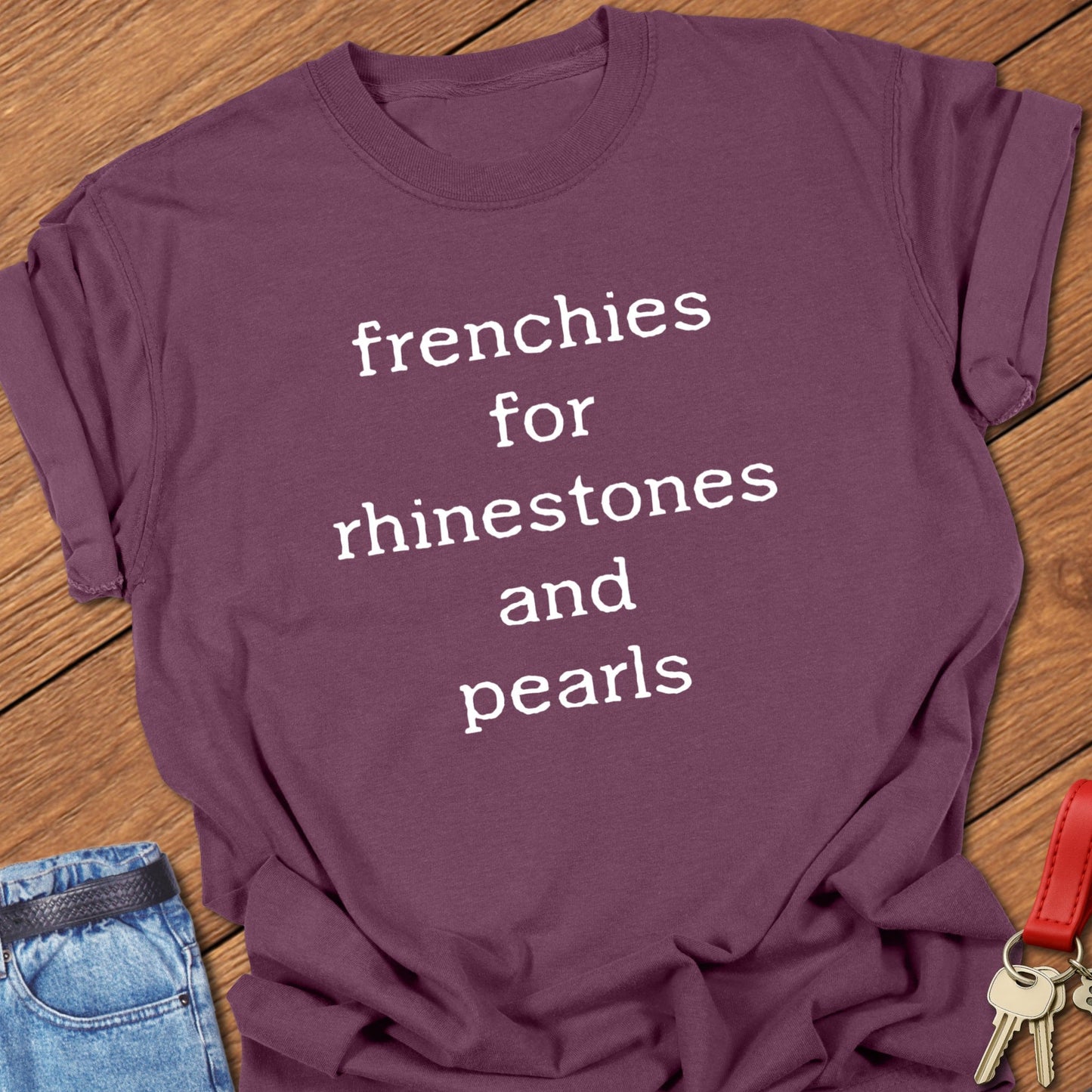 French bulldog typography quote design reading “frenchies for rhinestones and pearls” printed on berry Comfort Colors t shirt