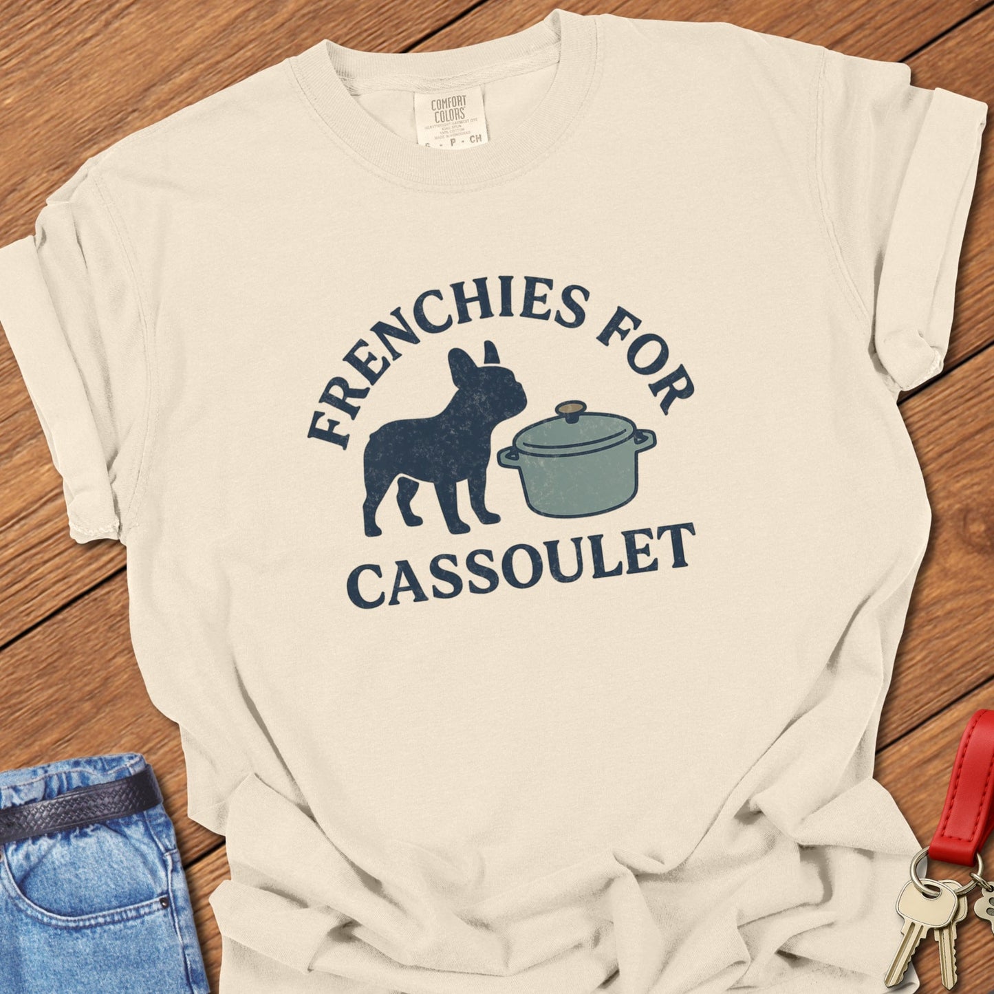 French bulldog humorous French food illustration with cassoulet pot graphic and bold typography printed on granite Comfort Colors t shirt