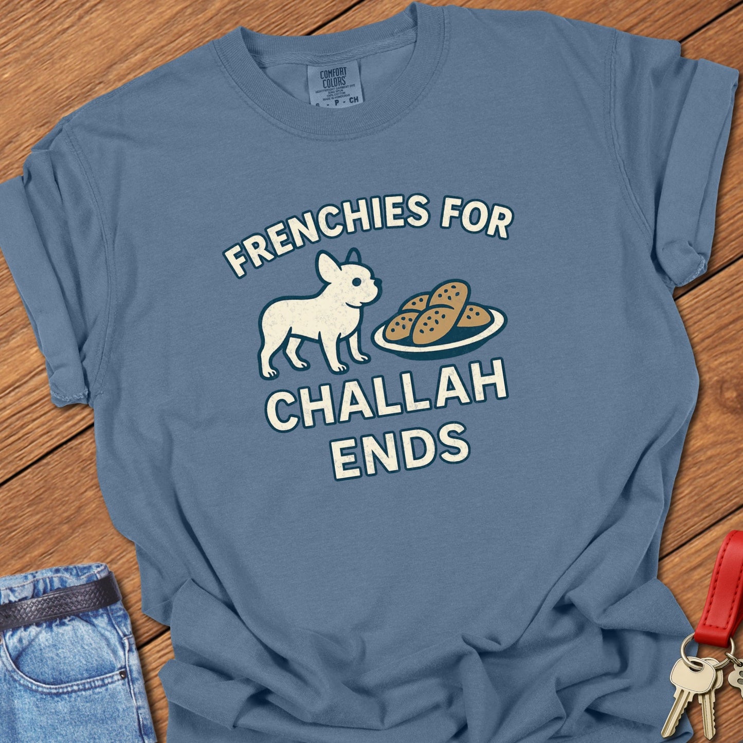 French bulldog humorous food illustration with challah bread graphic and playful slogan printed on blue jean Comfort Colors t shirt