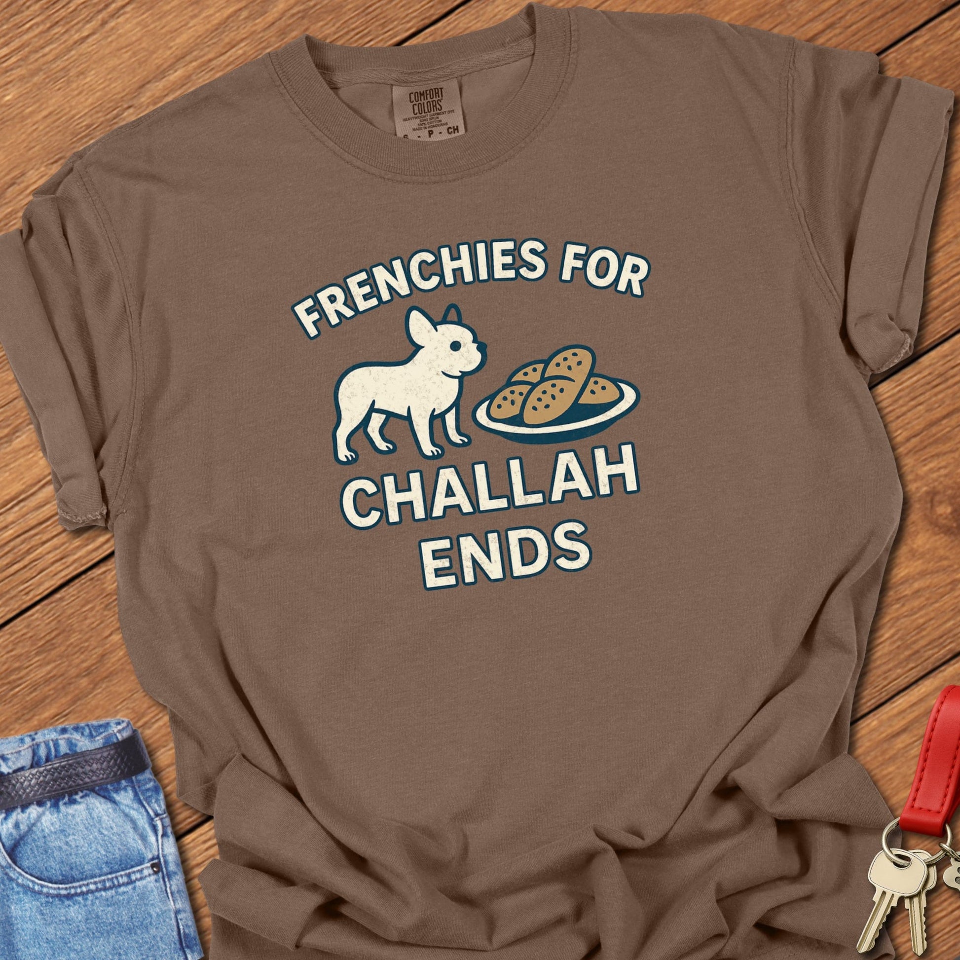 French bulldog humorous food illustration with challah bread graphic and playful slogan printed on espresso Comfort Colors t shirt