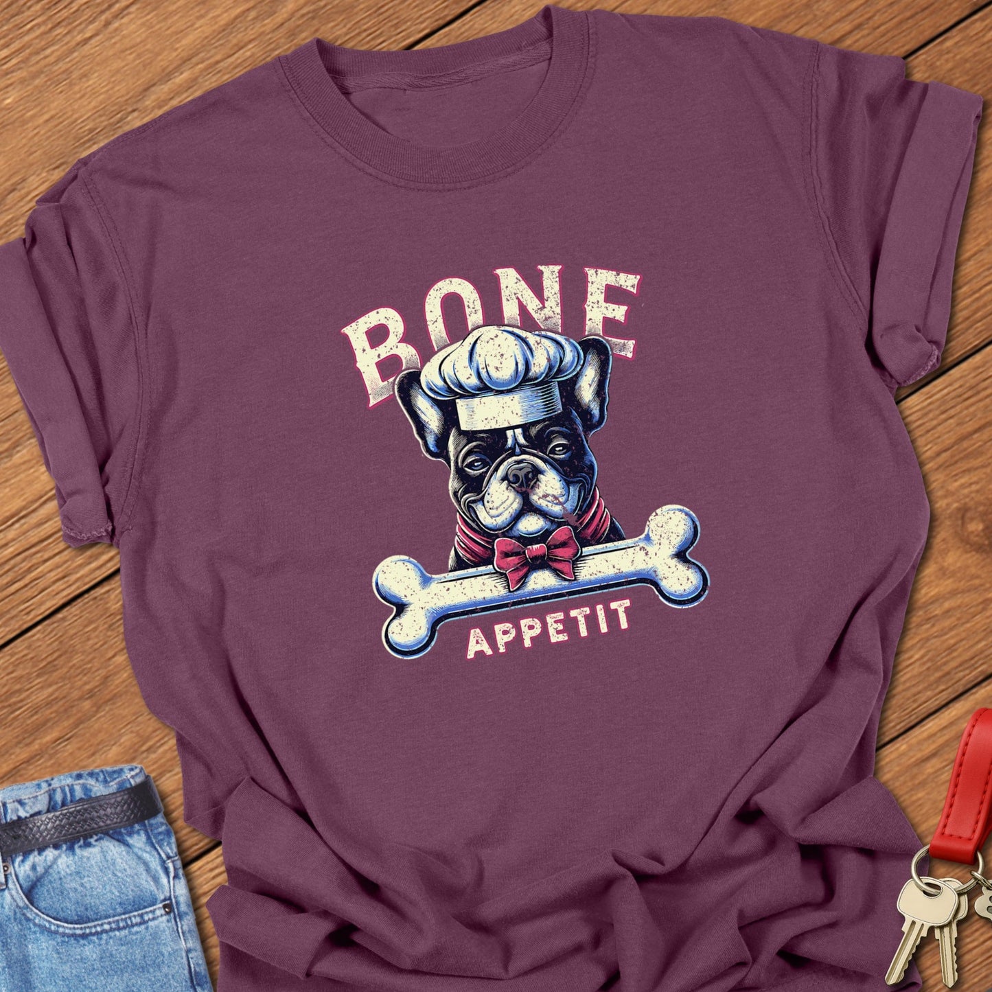 French bulldog chef with bone “Bone Appetit” design printed on berry Comfort Colors t shirt