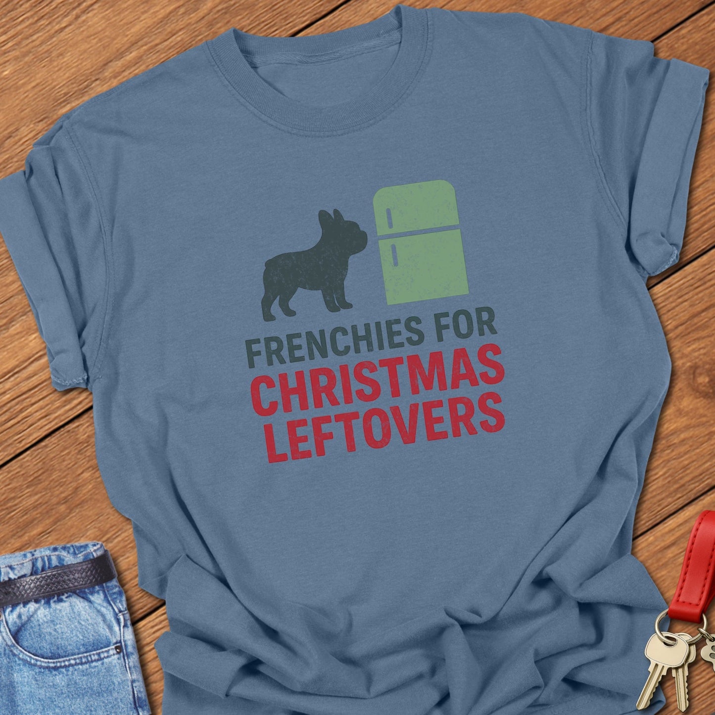 French bulldog humorous Christmas leftovers illustration with fridge graphic and festive typography printed on blue jean Comfort Colors t shirt