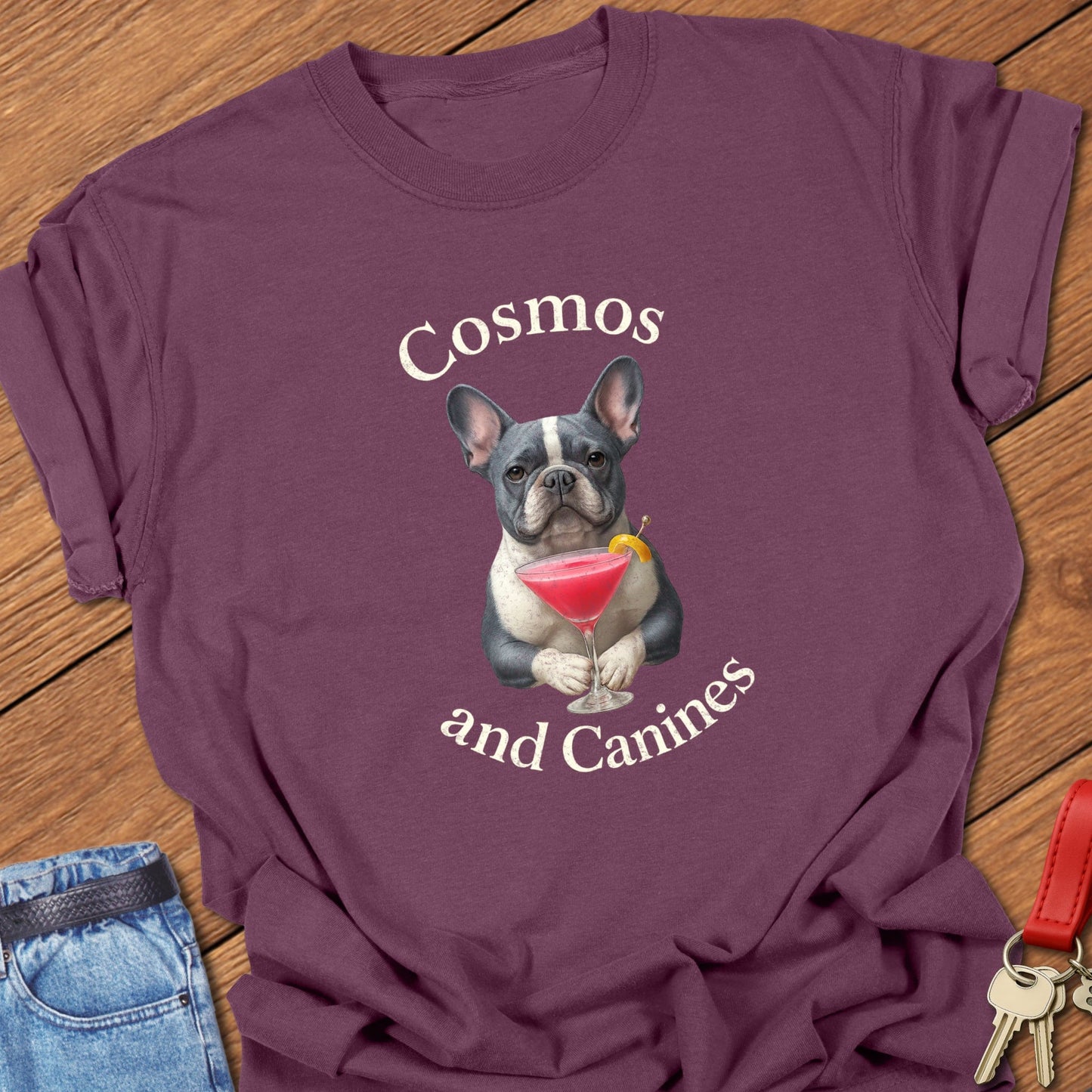 French bulldog cocktail illustration with cosmopolitan martini glass and playful typography printed on berry Comfort Colors t shirt