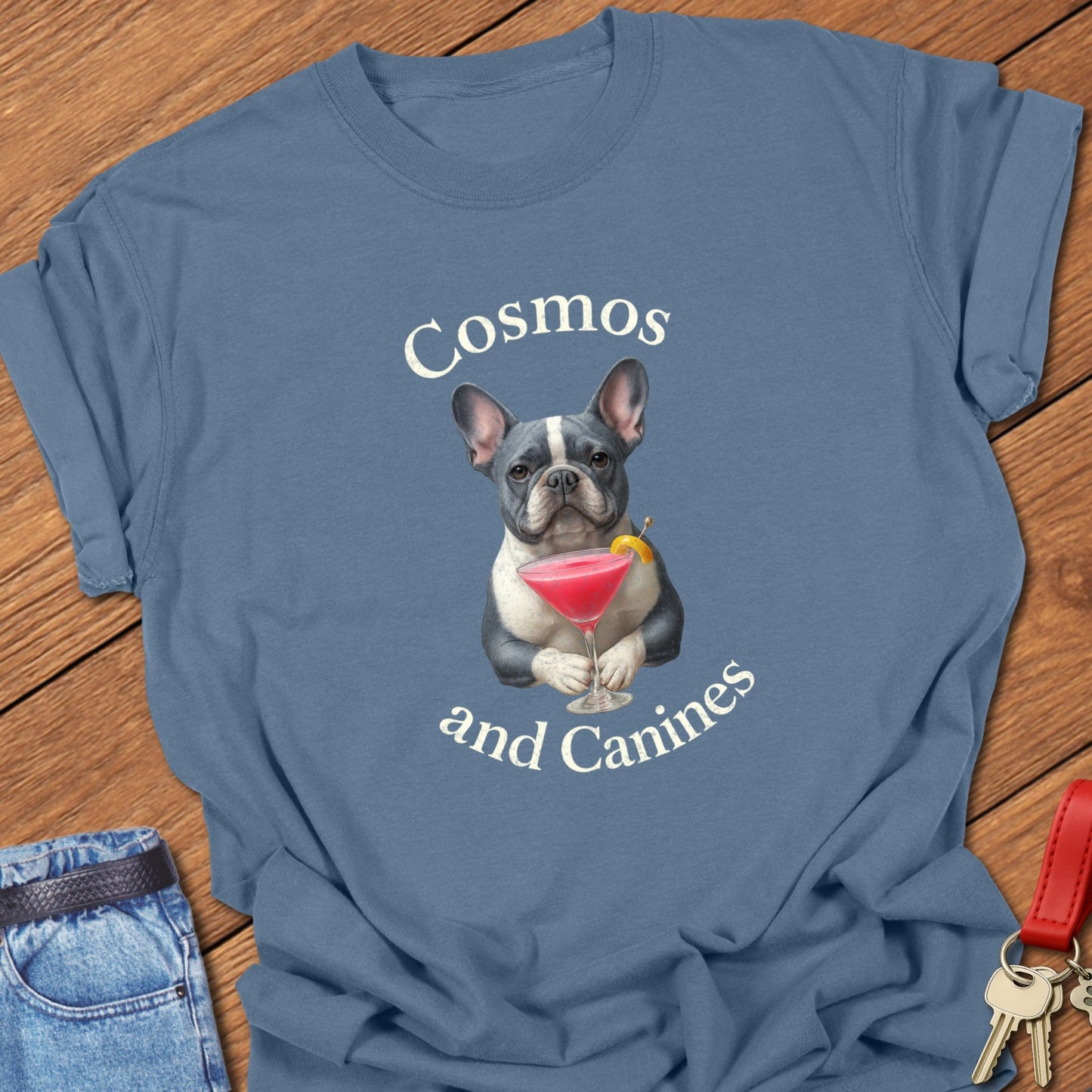 French bulldog cocktail illustration with cosmopolitan martini glass and playful typography printed on blue jean Comfort Colors t shirt