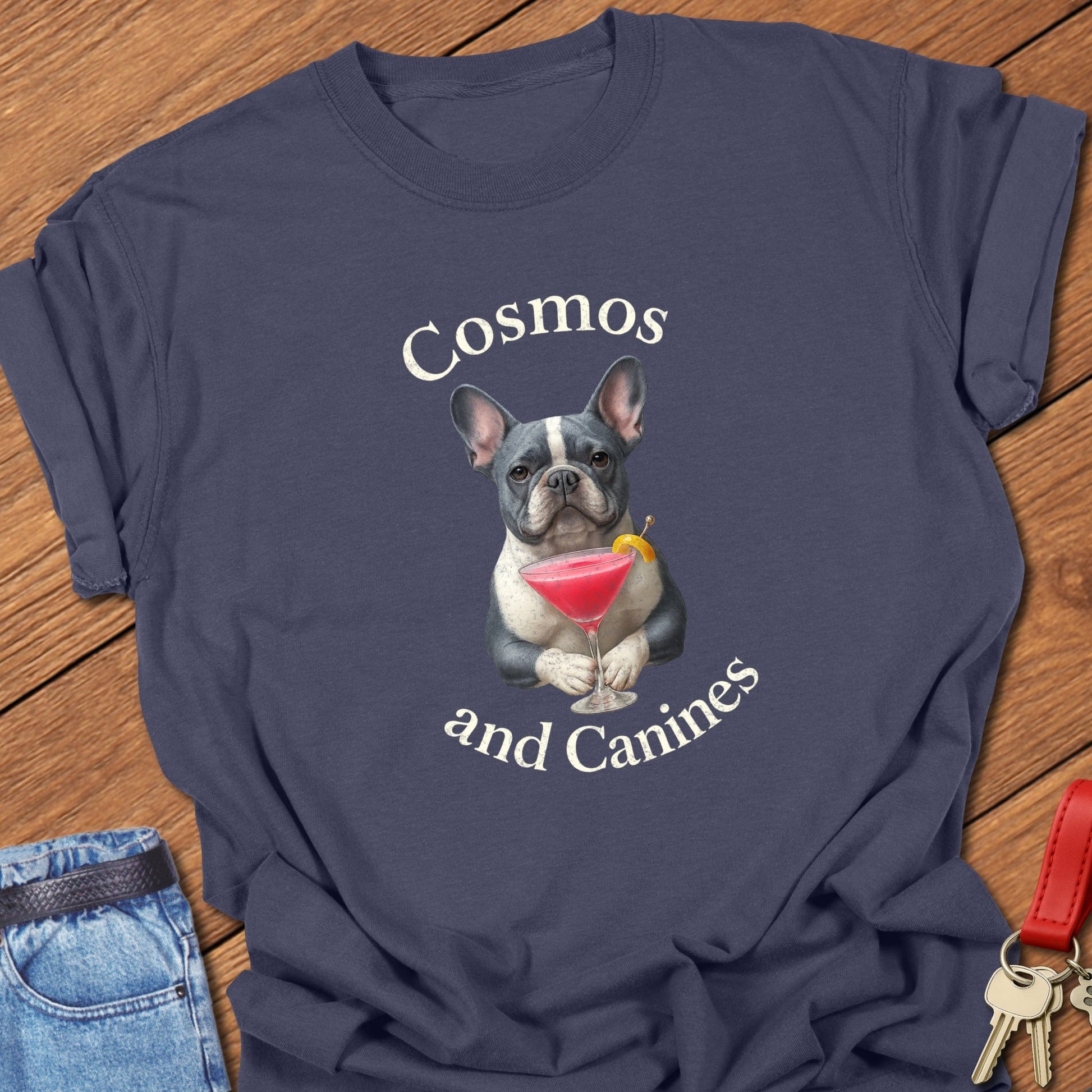 French bulldog cocktail illustration with cosmopolitan martini glass and playful typography printed on navy Comfort Colors t shirt