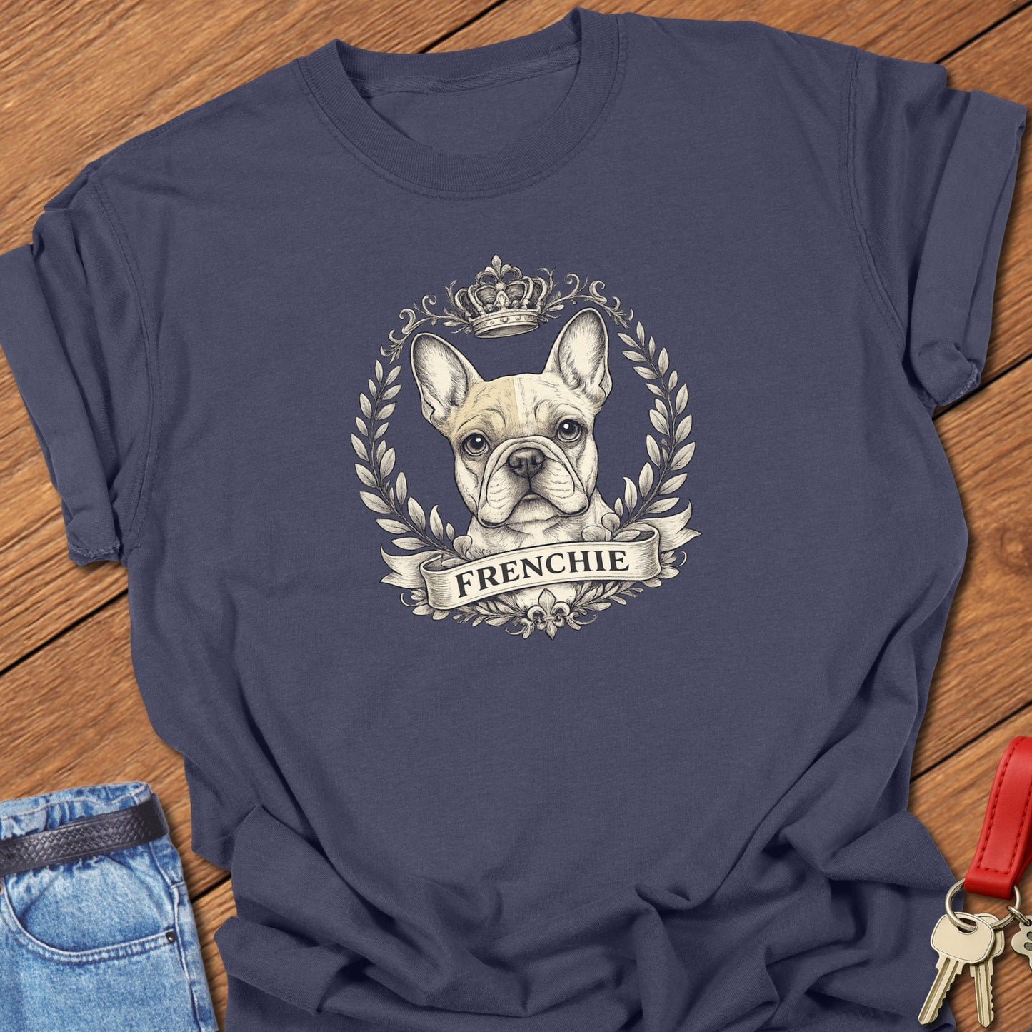 French bulldog vintage laurel crest illustration printed on navy Comfort Colors t shirt.