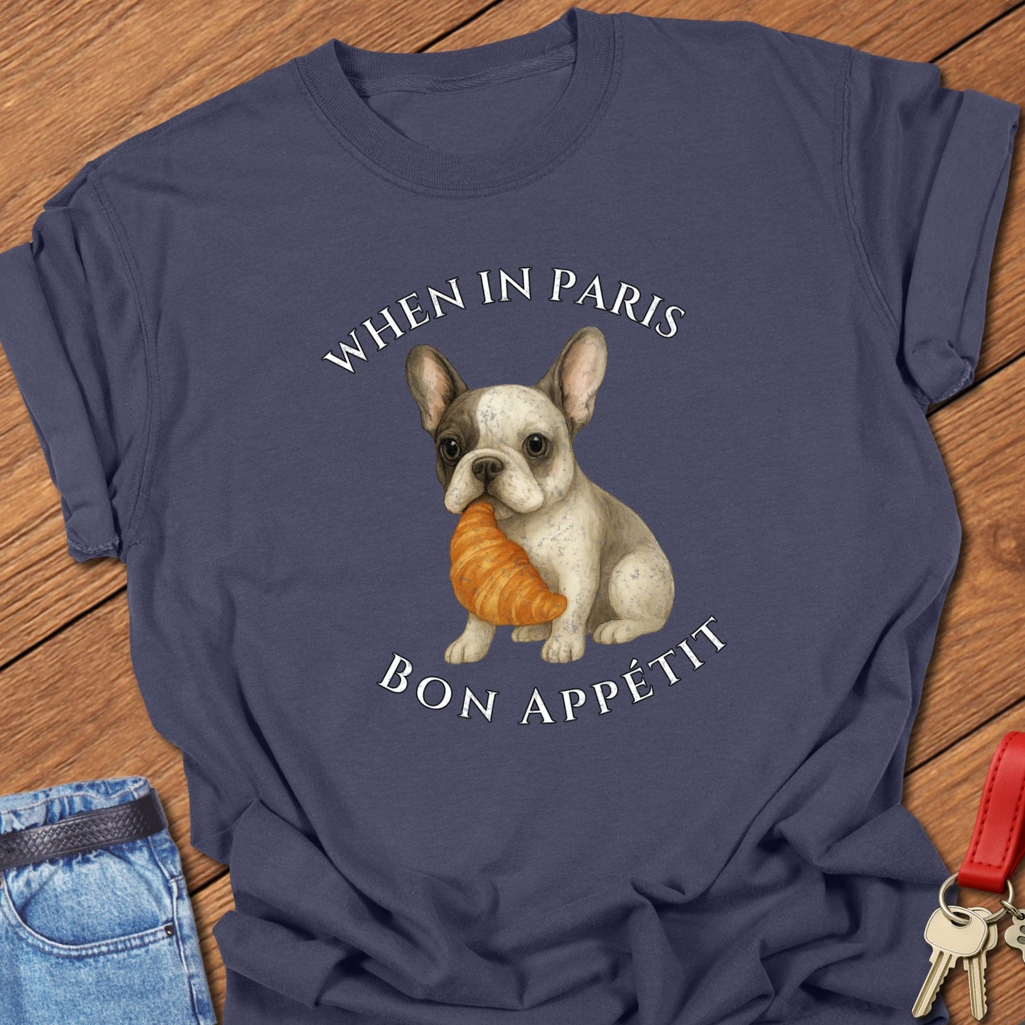 French bulldog croissant illustration printed on navy Comfort Colors t shirt