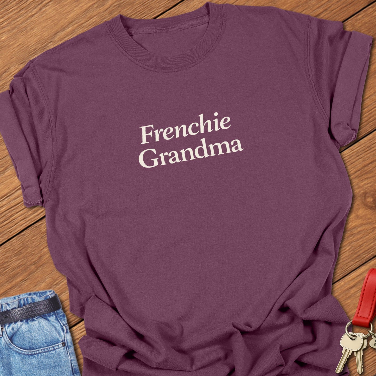 Frenchie Grandma t-shirt with minimalist black typography printed on Comfort Colors orchid garment dyed shirt in Berry.

