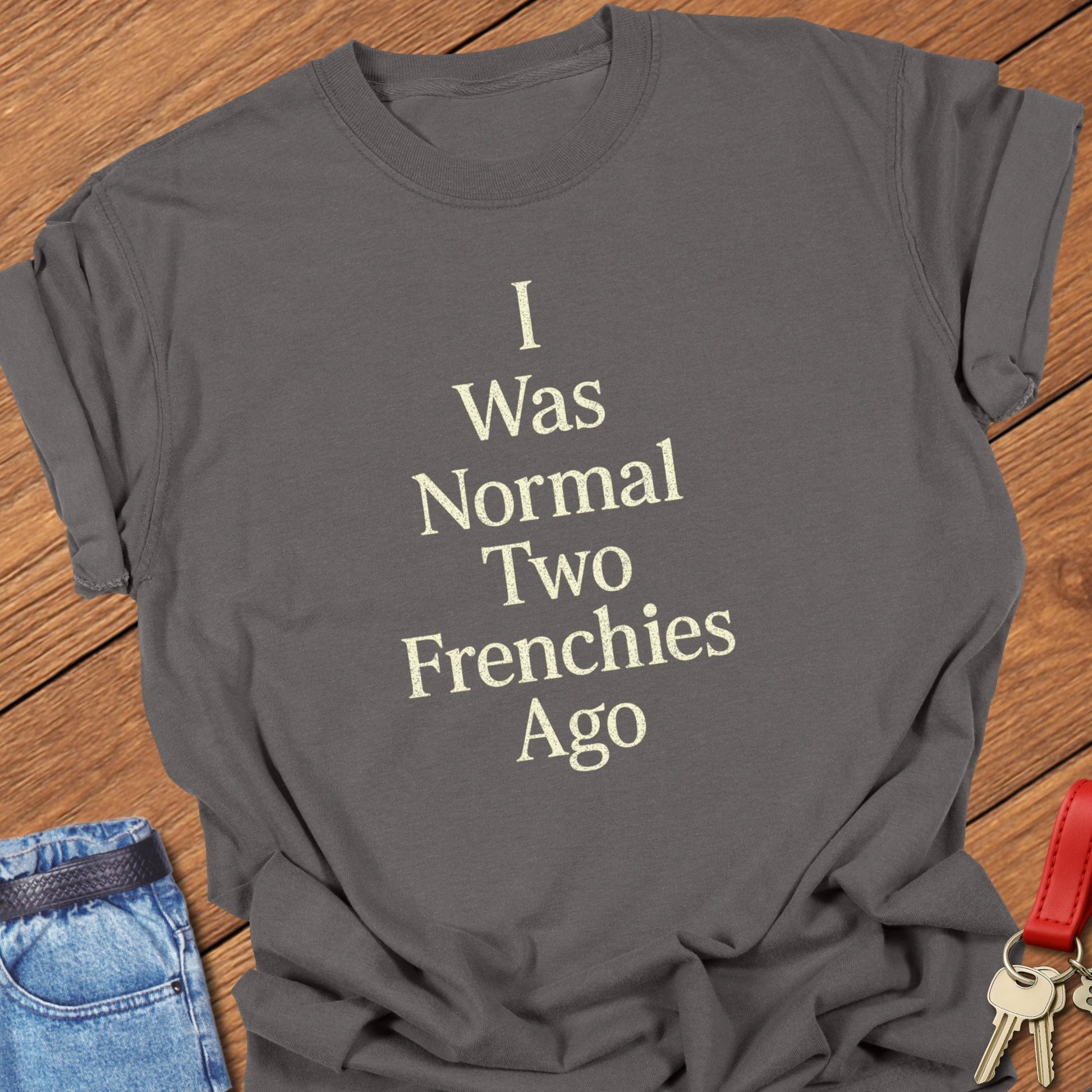 French bulldog “I Was Normal Two Frenchies Ago” minimalist text design printed on pepper Comfort Colors t shirt