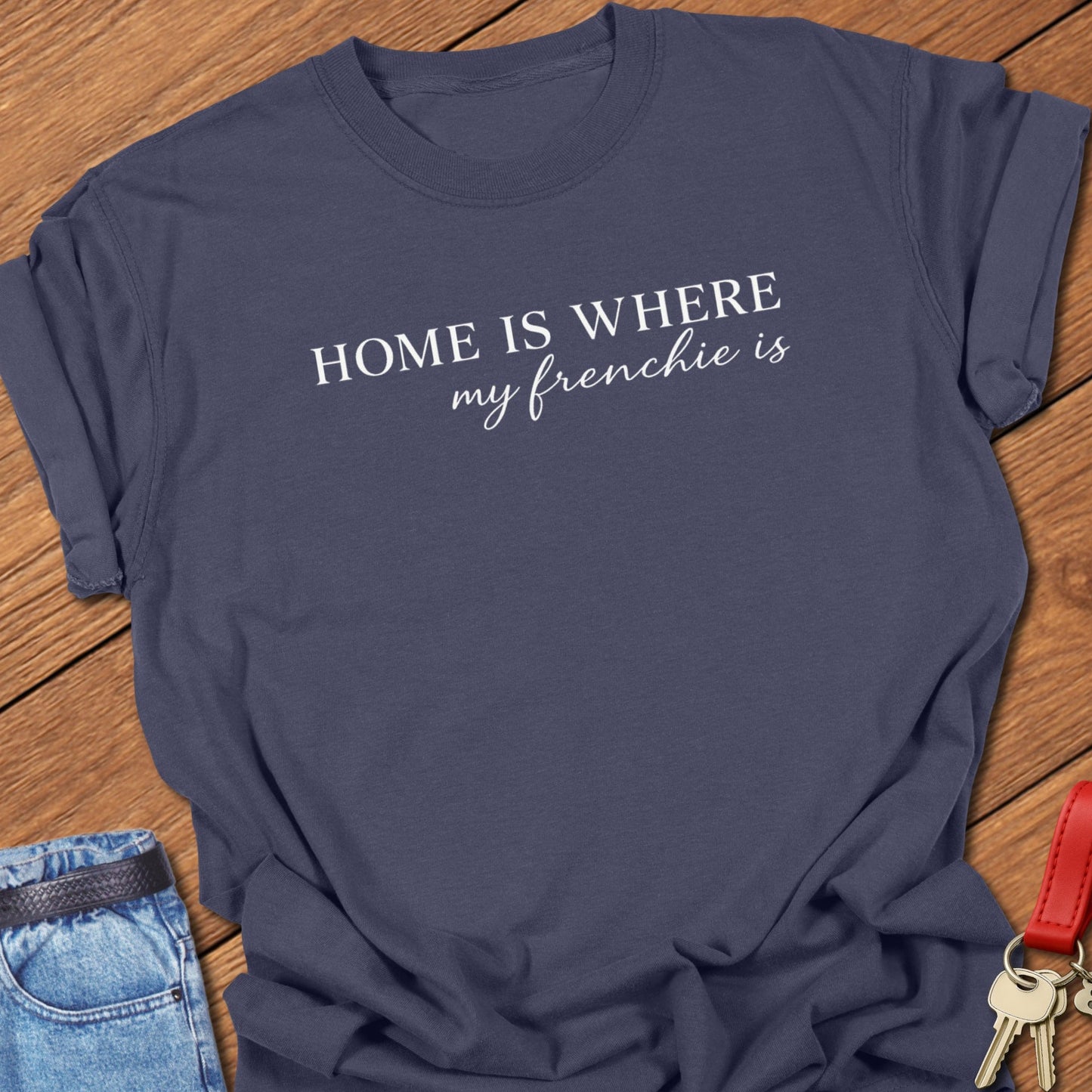 French bulldog home is where my frenchie is text graphic printed on navy Comfort Colors t shirt.