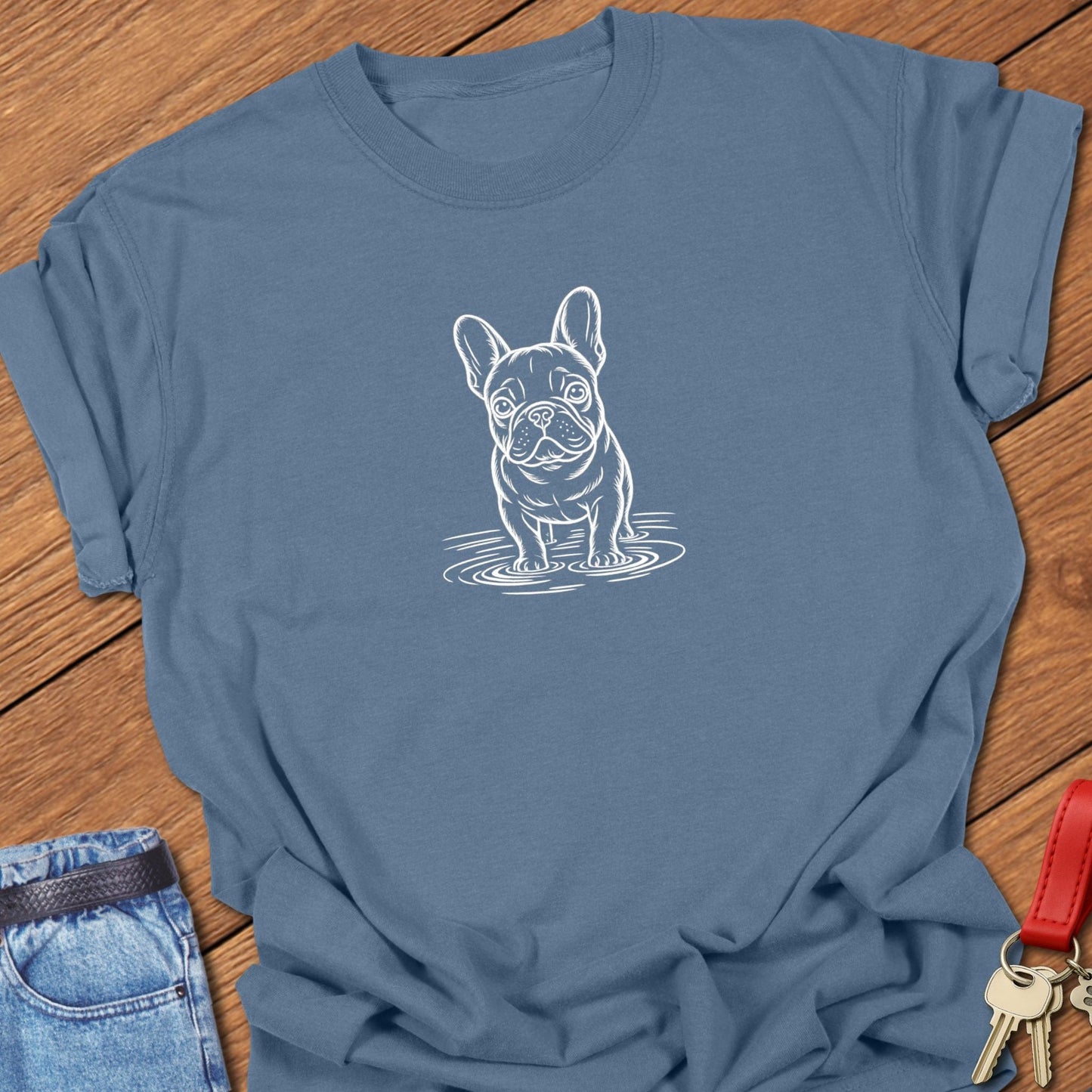 French bulldog line art standing in water graphic printed on blue jean Comfort Colors t shirt.