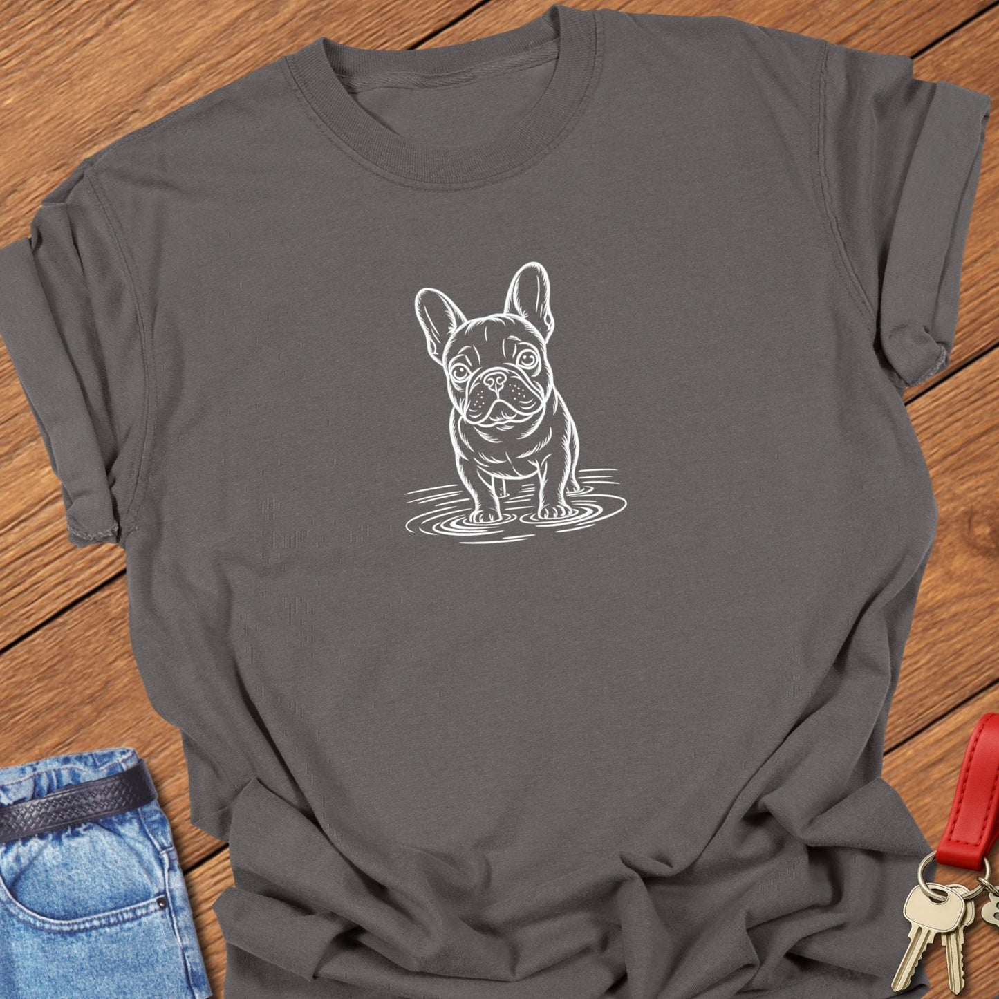 French bulldog line art standing in water graphic printed on espresso Comfort Colors t shirt.