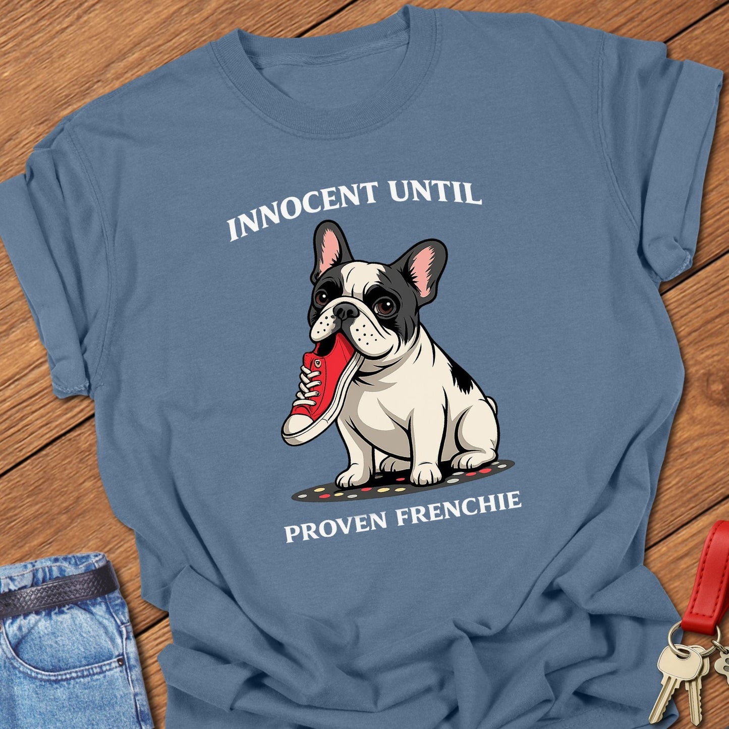 French bulldog innocent until proven frenchie cartoon graphic printed on blue jean Comfort Colors t shirt.