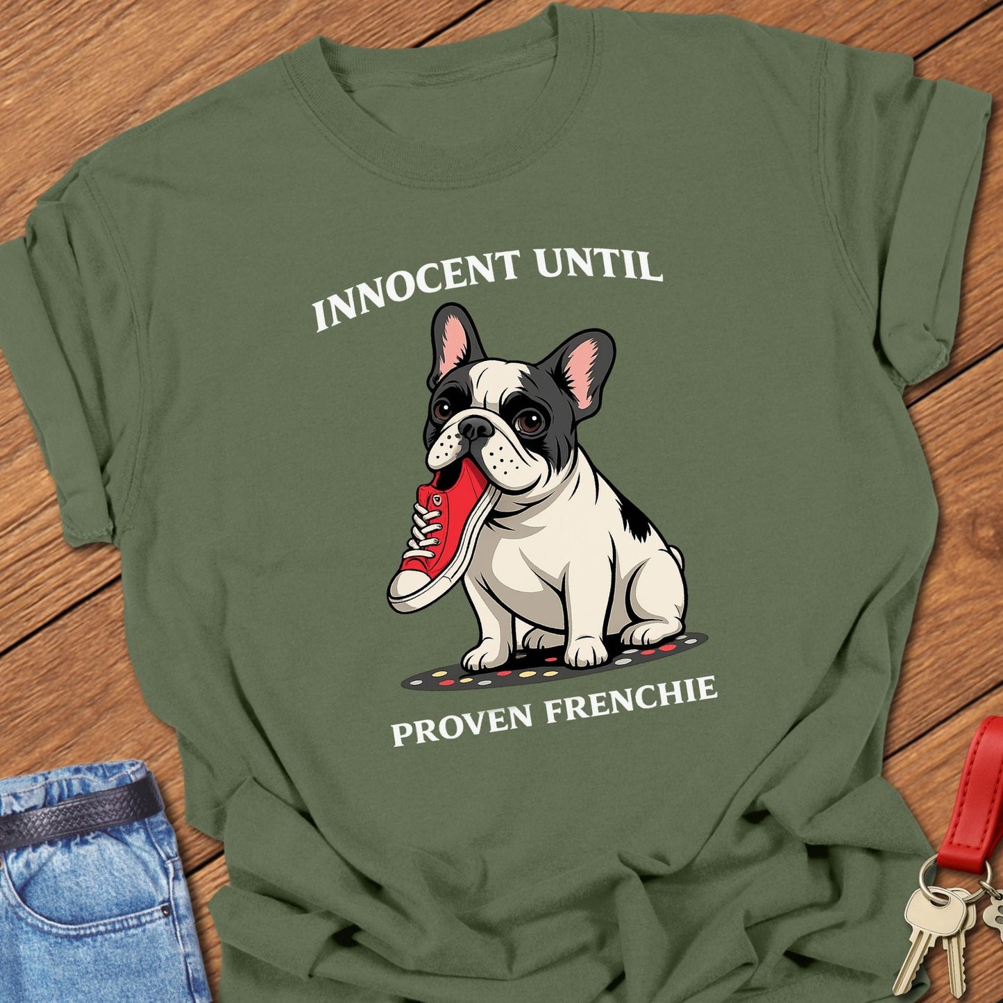 French bulldog innocent until proven frenchie cartoon graphic printed on moss Comfort Colors t shirt.