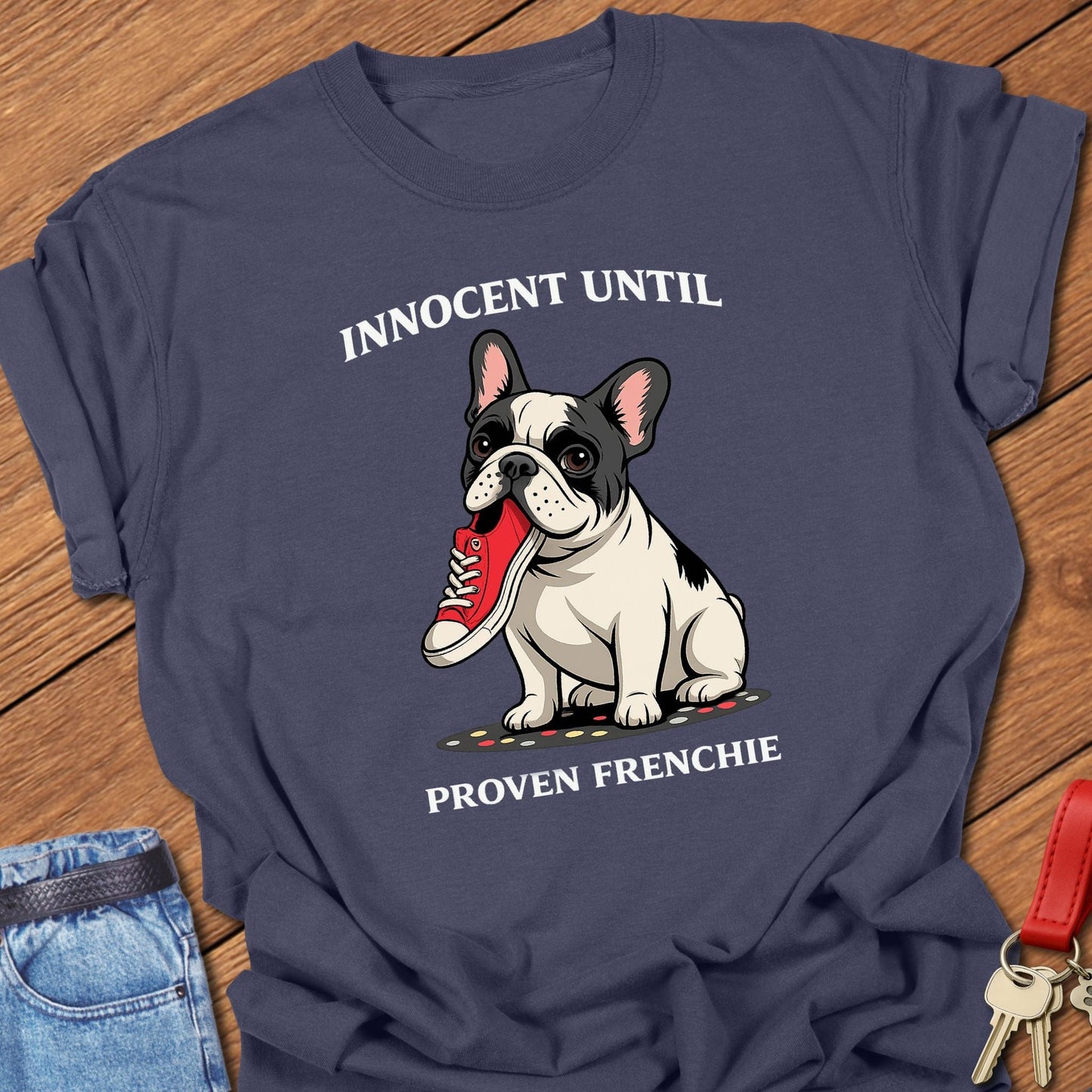 French bulldog innocent until proven frenchie cartoon graphic printed on navy Comfort Colors t shirt.