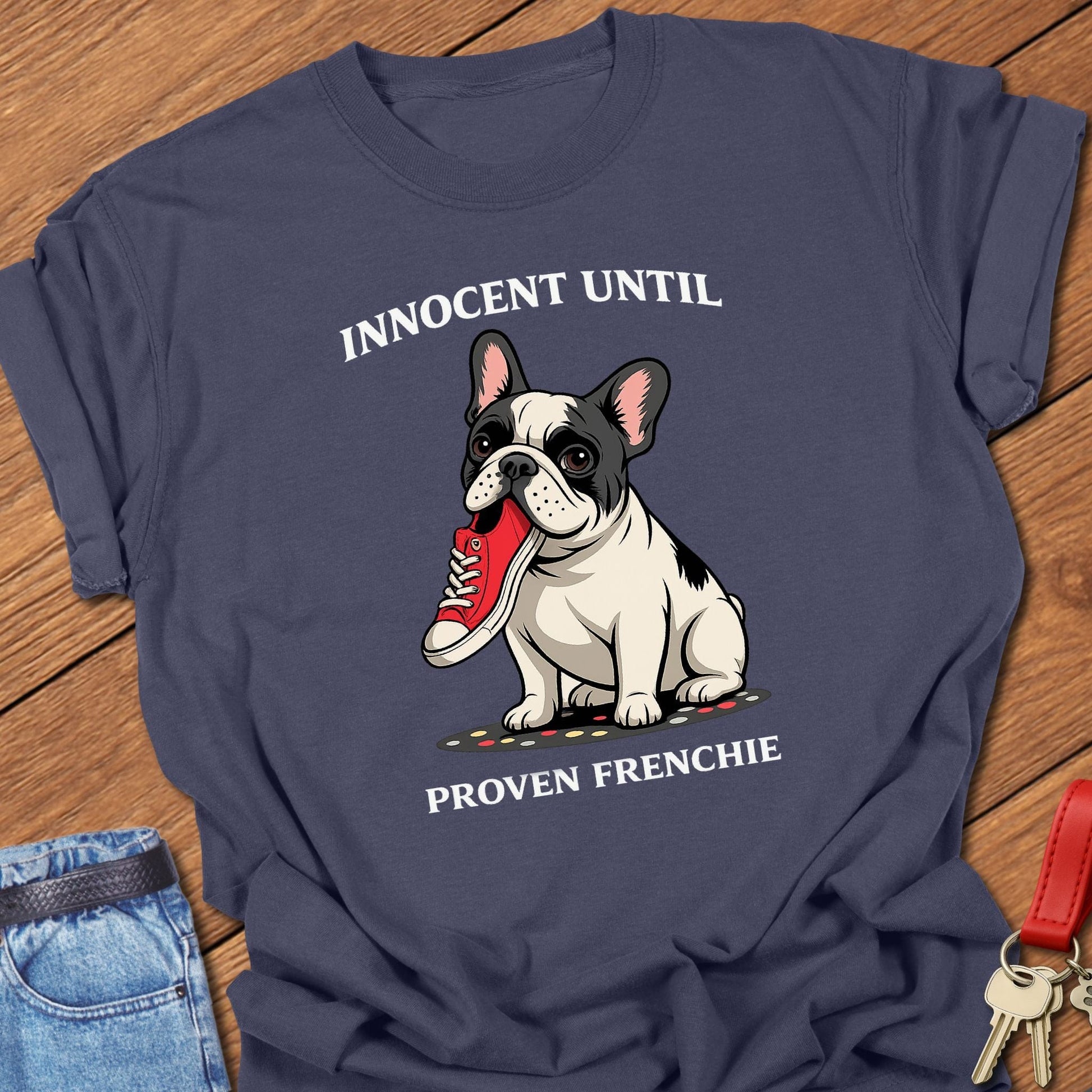French bulldog innocent until proven frenchie cartoon graphic printed on navy Comfort Colors t shirt.