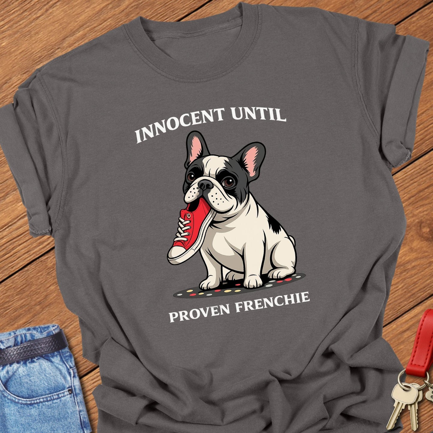 French bulldog innocent until proven frenchie cartoon graphic printed on pepper Comfort Colors t shirt.