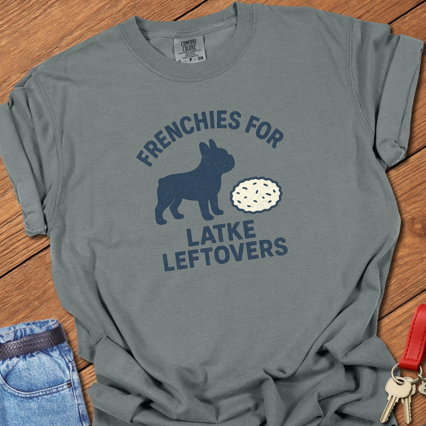 French bulldog humorous food illustration with latke graphic and playful slogan printed on granite Comfort Colors t shirt