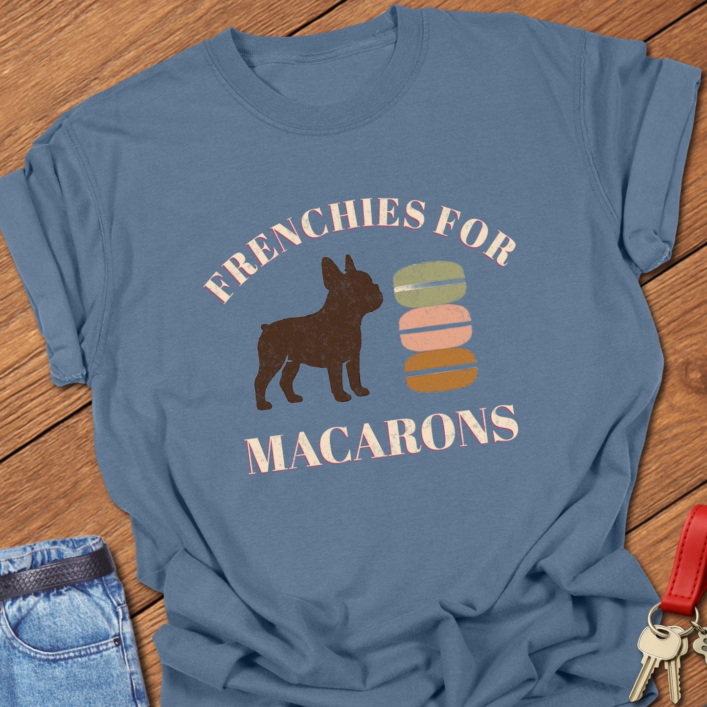 French bulldog French dessert illustration with colorful macaron stack graphic and bold typography printed on blue jean Comfort Colors t shirt