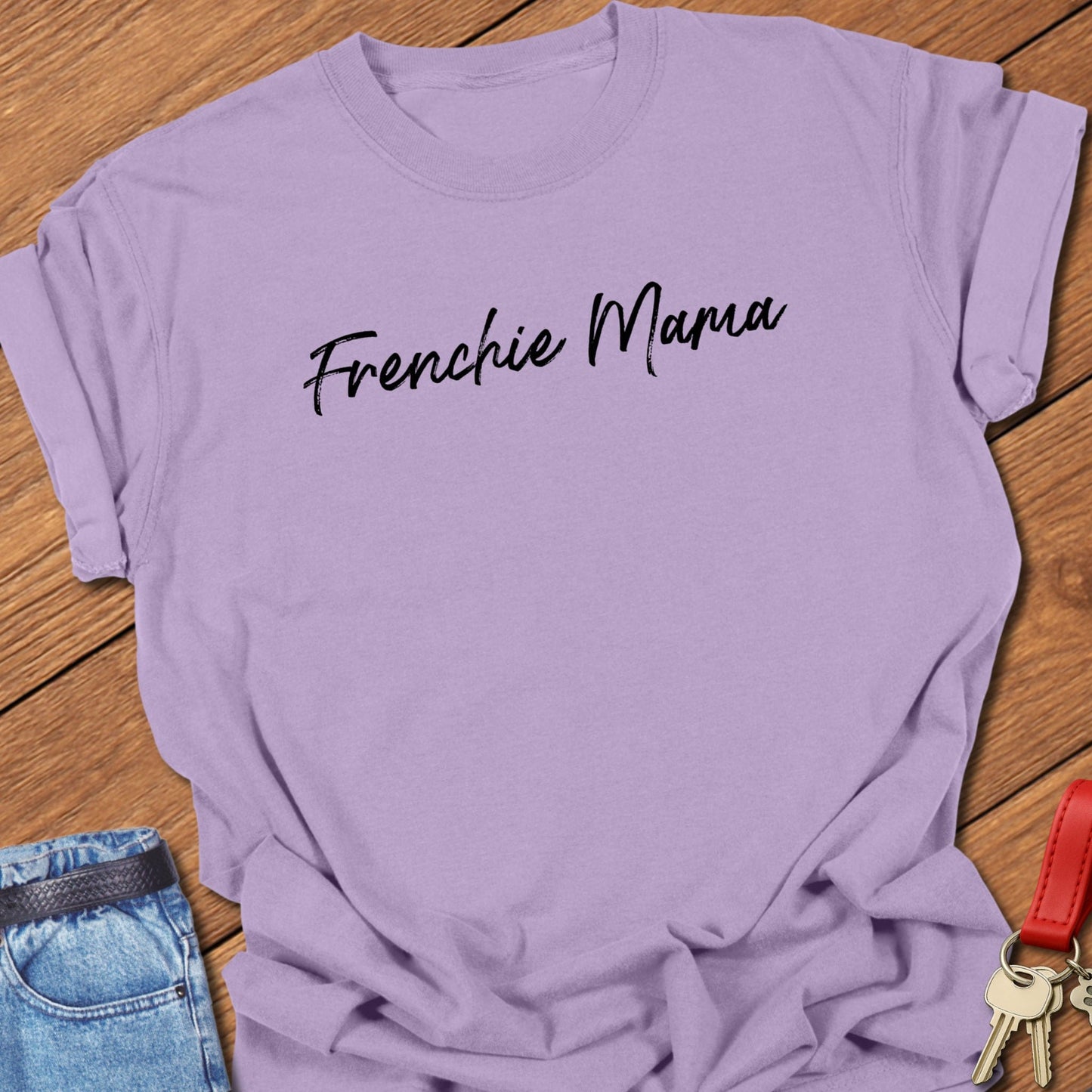 French bulldog “Frenchie Mama” handwritten script text design printed on orchid Comfort Colors t shirt.