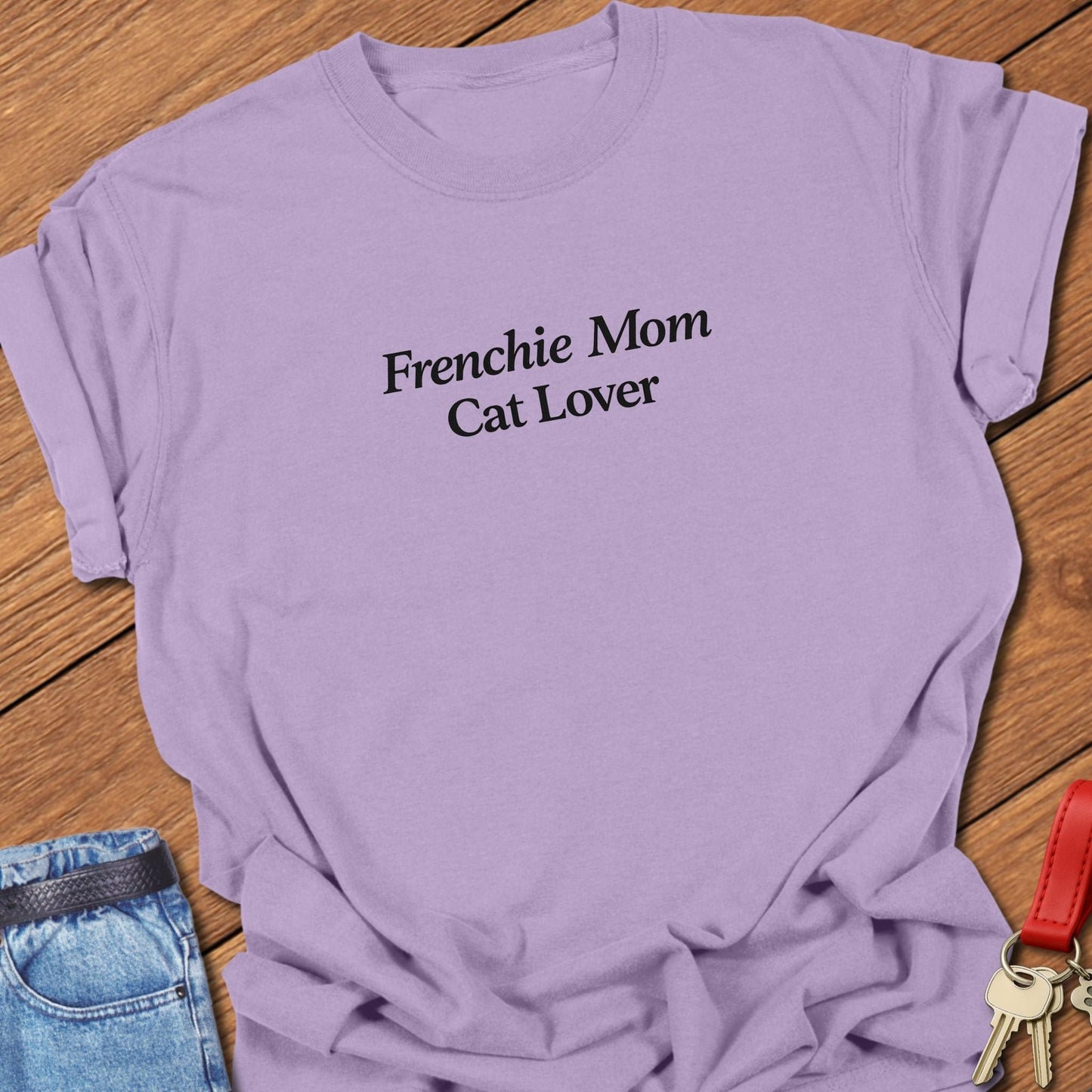 Minimalist serif text design reading “Frenchie Mom Cat Lover” on garment-dyed Comfort Colors t shirt in orchid.