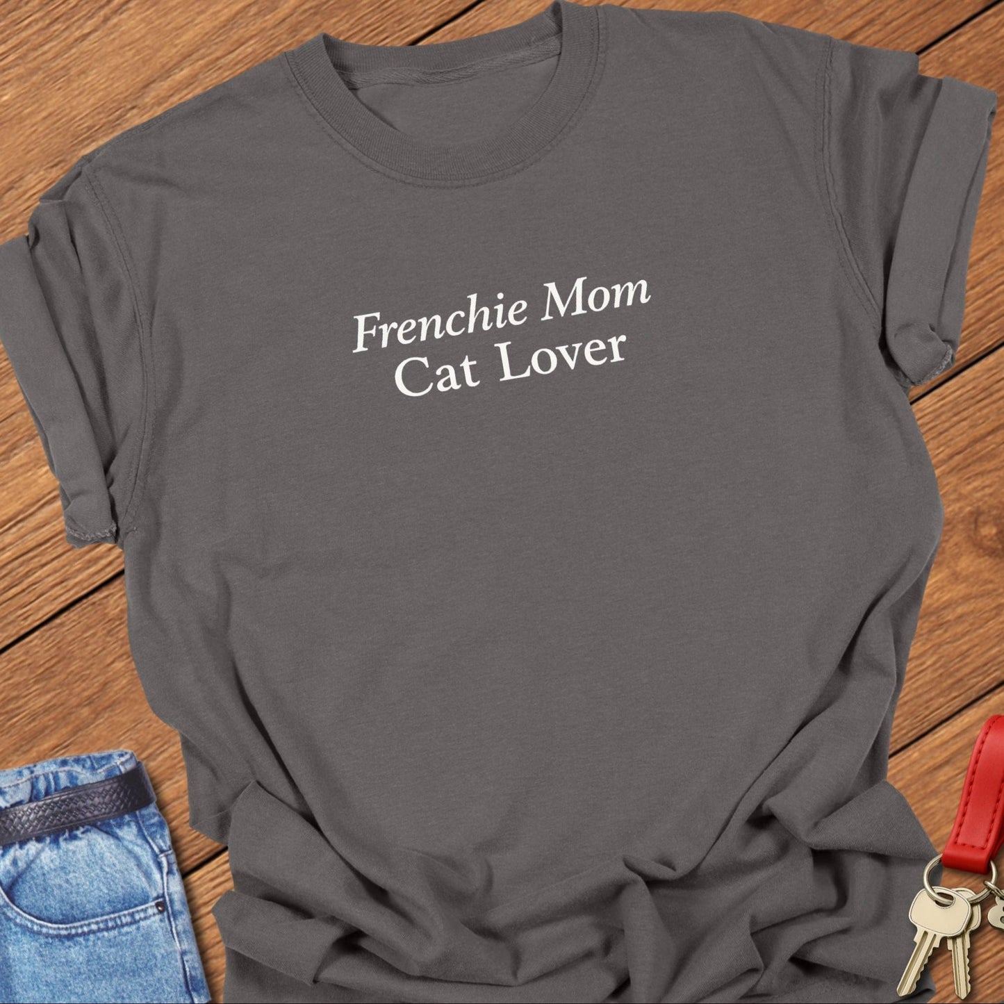 Minimalist serif text design reading “Frenchie Mom Cat Lover” on garment-dyed Comfort Colors t shirt in pepper.
