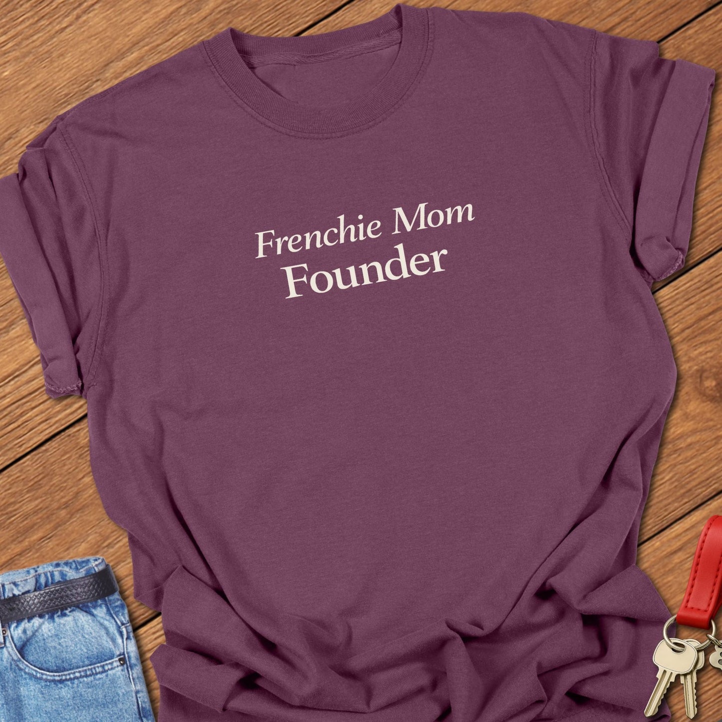 Frenchie Mom Founder text design printed in black serif typography on a garment-dyed Comfort Colors t shirt in berry.