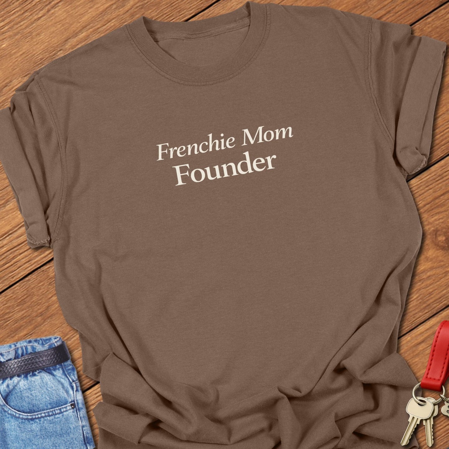Frenchie Mom Founder text design printed in black serif typography on a garment-dyed Comfort Colors t shirt in espresso.