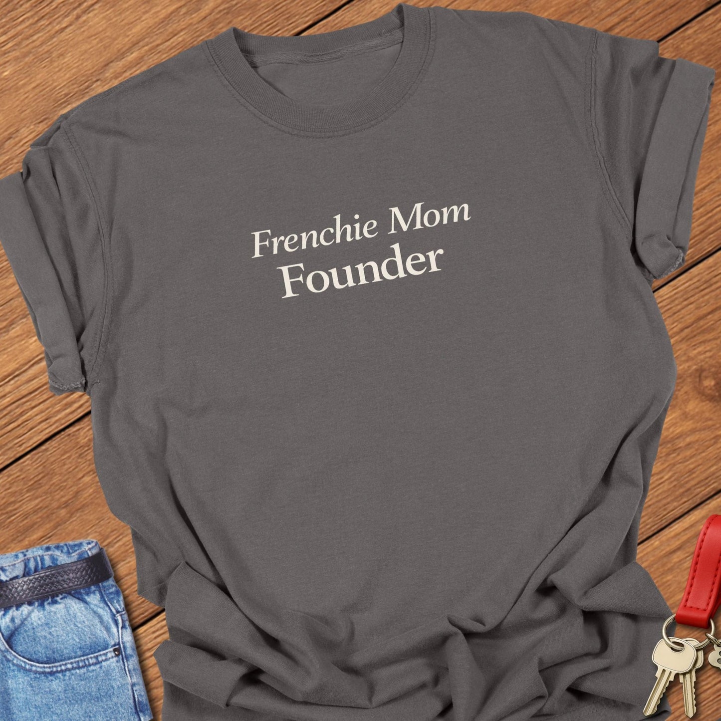 Frenchie Mom Founder text design printed in black serif typography on a garment-dyed Comfort Colors t shirt in pepper.