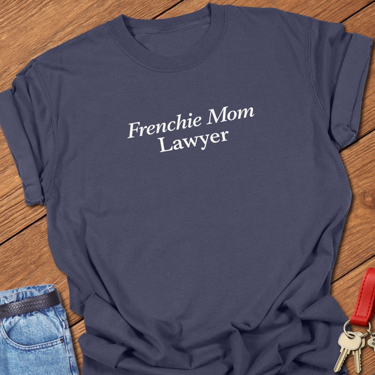 Minimalist serif text design reading “Frenchie Mom Lawyer” on garment-dyed Comfort Colors t shirt in navy.
