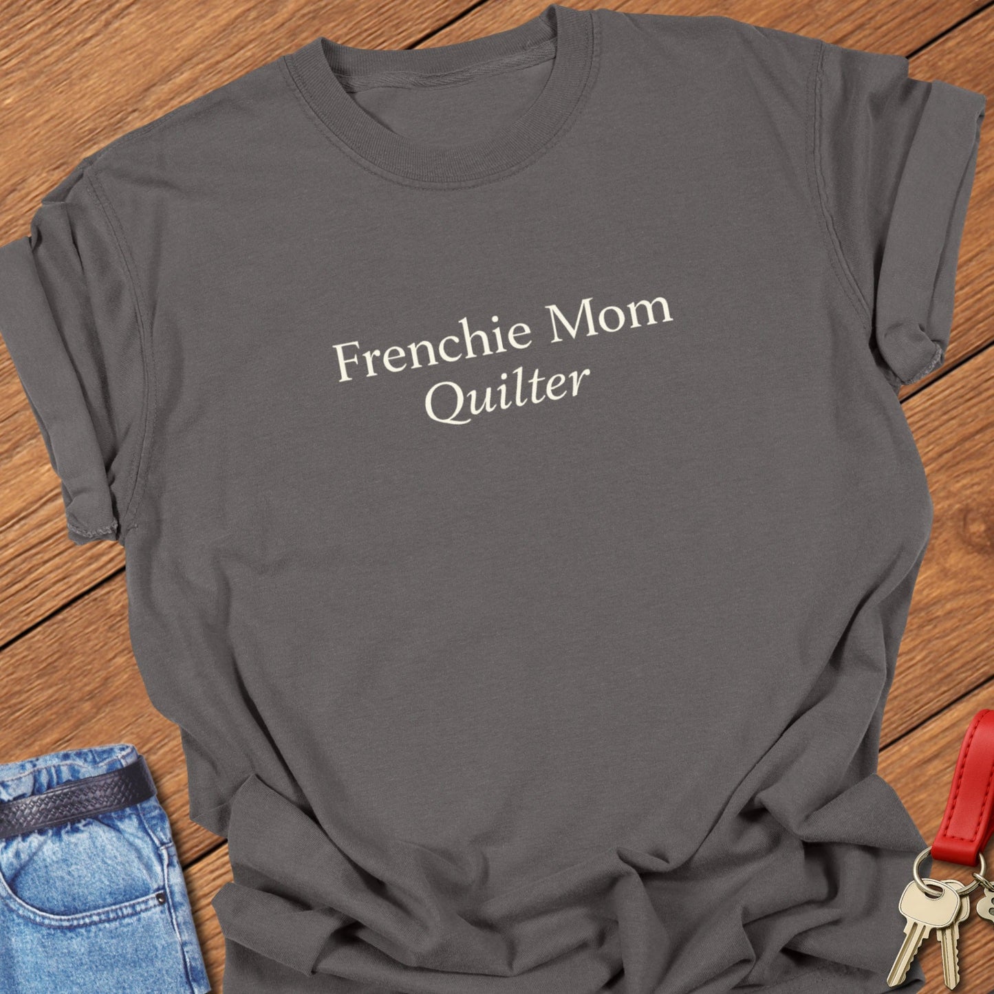 Frenchie Mom Quilter shirt with minimalist typography printed on Comfort Colors Peooer t-shirt.